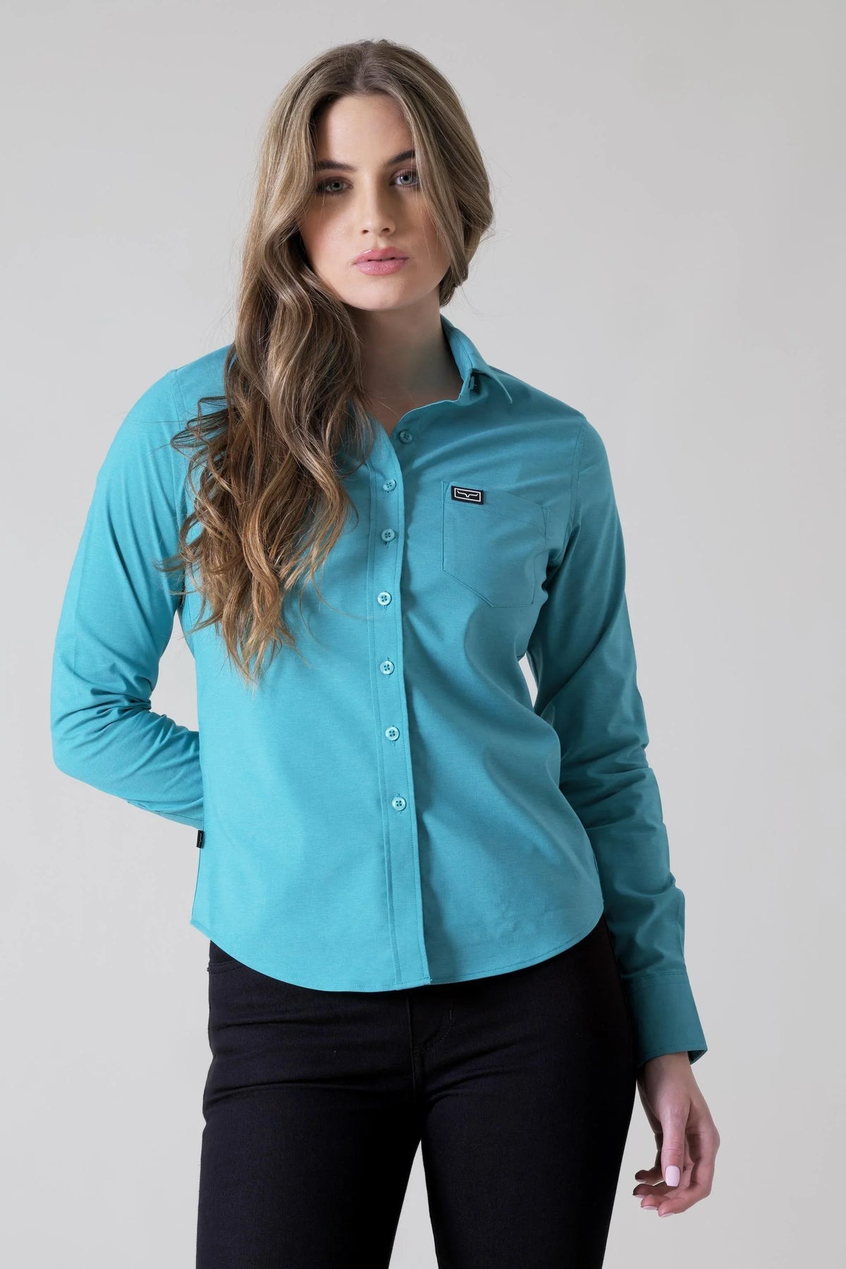 Kimes Ranch Ladies Linville top in Teal with a button front and chest pocket