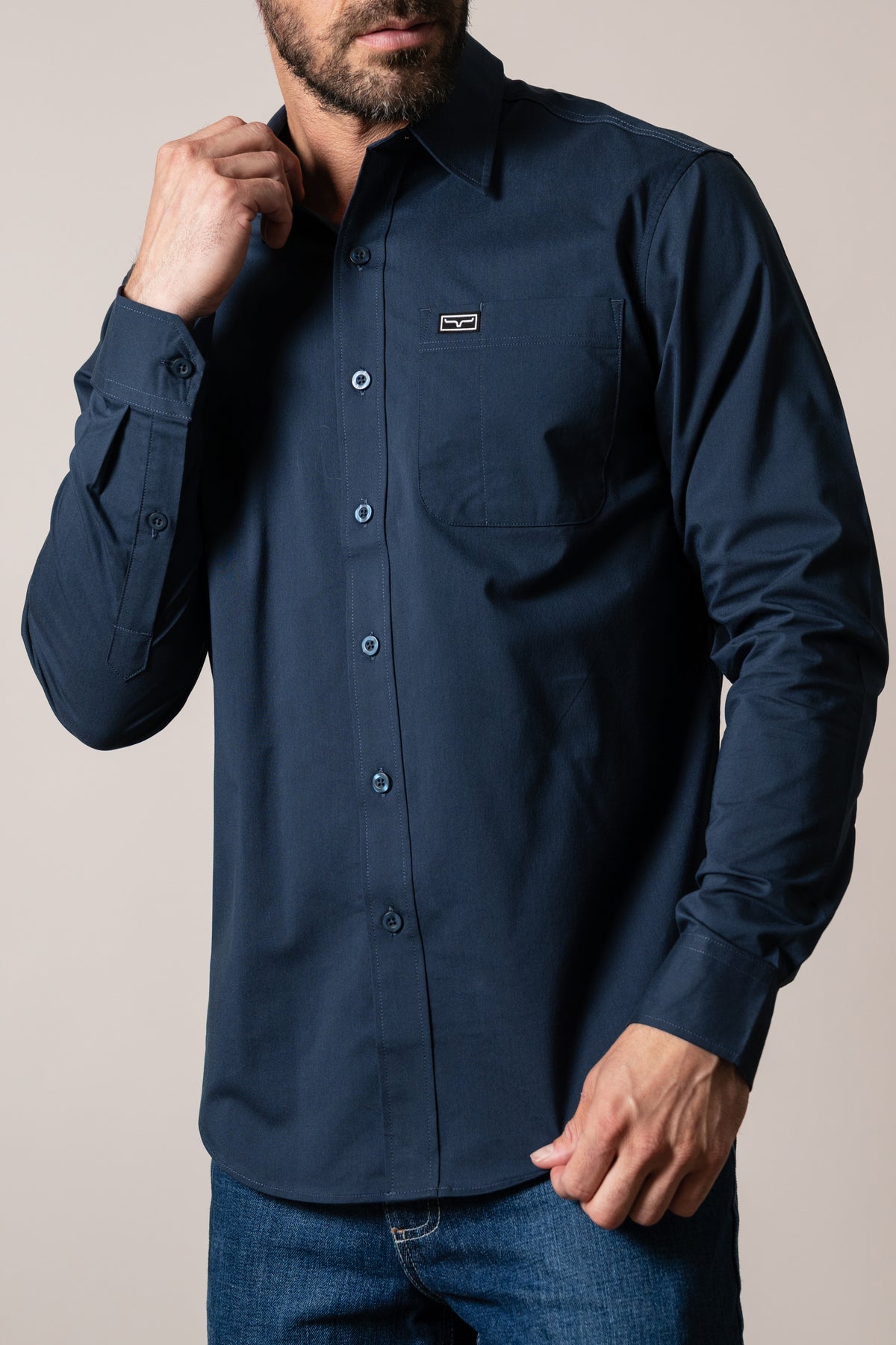 Kimes Ranch Linville Long Sleeve Dress Shirt in Navy with a chest pocket and logo patch