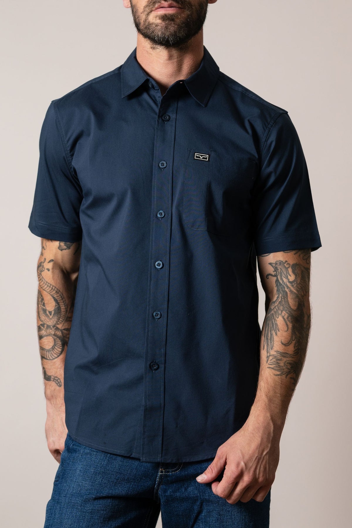 Kimes Ranch Linville Short Sleeve Dress Shirt in Navy with a chest pocket and logo patch