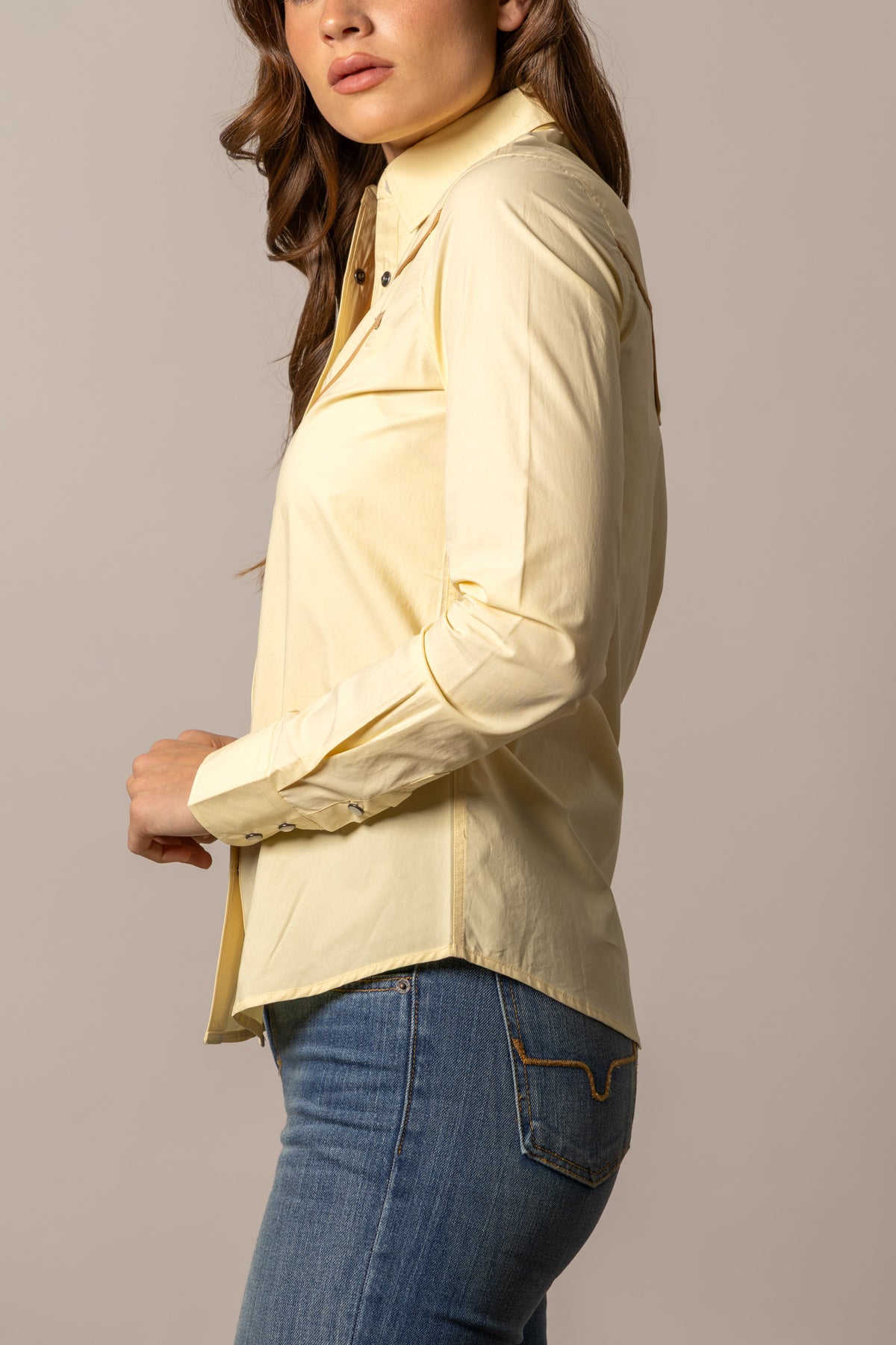 Kimes Ranch Logo Horn Blouse in Soft Gold, side view, with a button-down collar and long sleeves