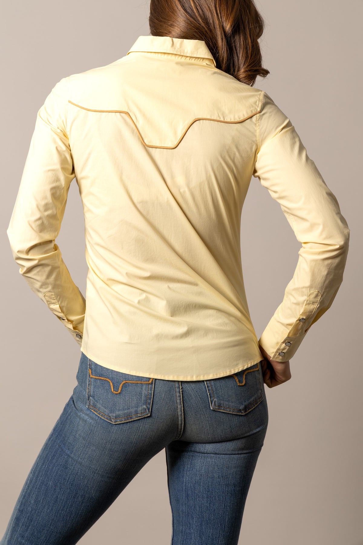 Kimes Ranch Logo Horn Blouse in Soft Gold, back view, with contrast stitching on the back yoke and buttoned cuffs