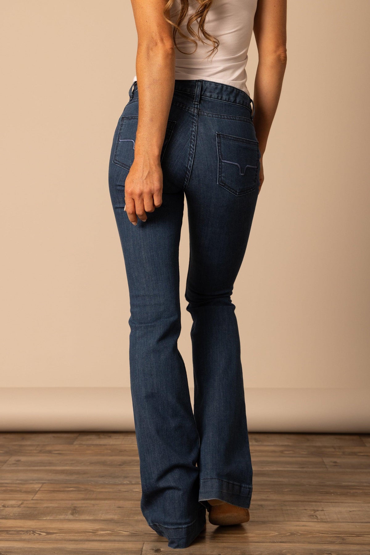 Kimes Ranch Lola jeans in Dark Wash, back view, with back pockets and flared leg