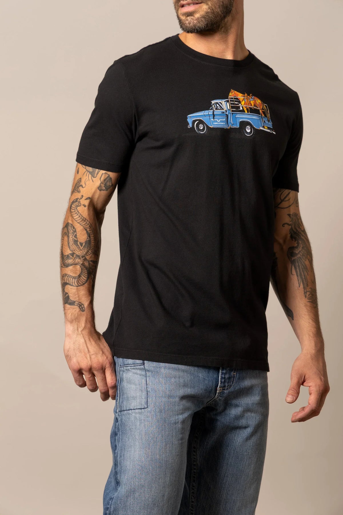 Kimes Ranch Lucky B Truck Black short sleeve shirt with a blue vintage truck graphic on the chest