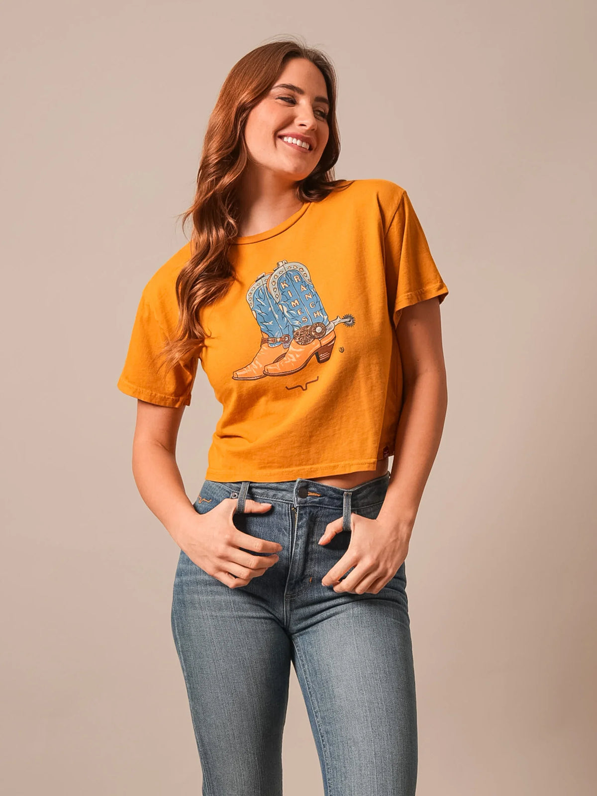 Kimes Ranch Lucky B Boots For Walkin' Gold short sleeve shirt with graphic of blue and tan cowboy boots and Kimes Ranch logo