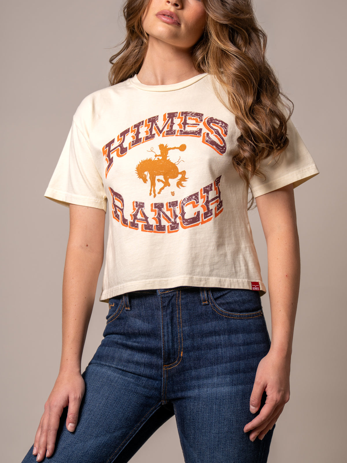Kimes Ranch Lucky B Bucking shirt in Ivory with a vintage bronc rider graphic and Kimes Ranch logo