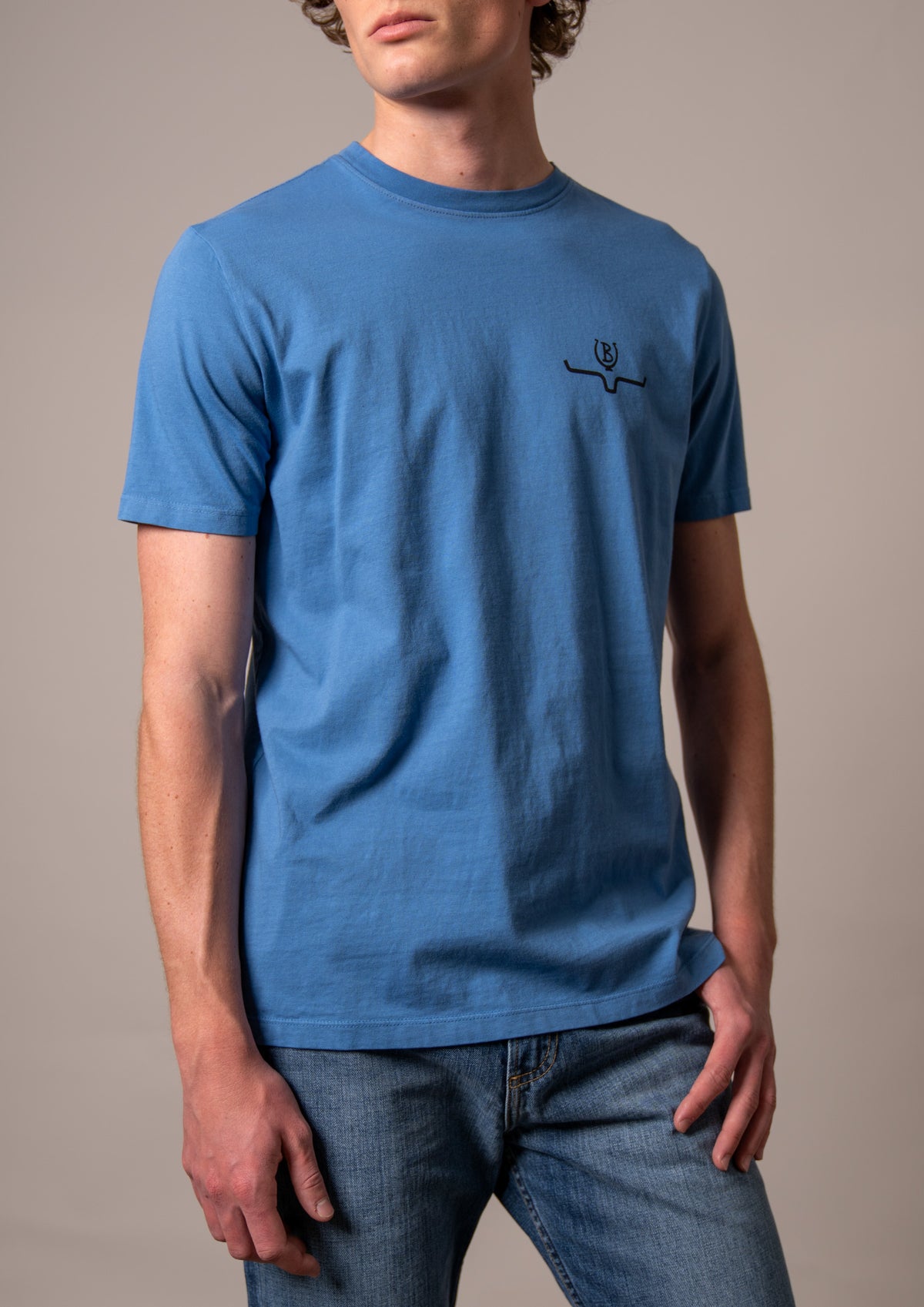 Kimes Ranch Lucky B Bucking shirt in Mid Blue with short sleeves and a crew neck and a small logo on the chest