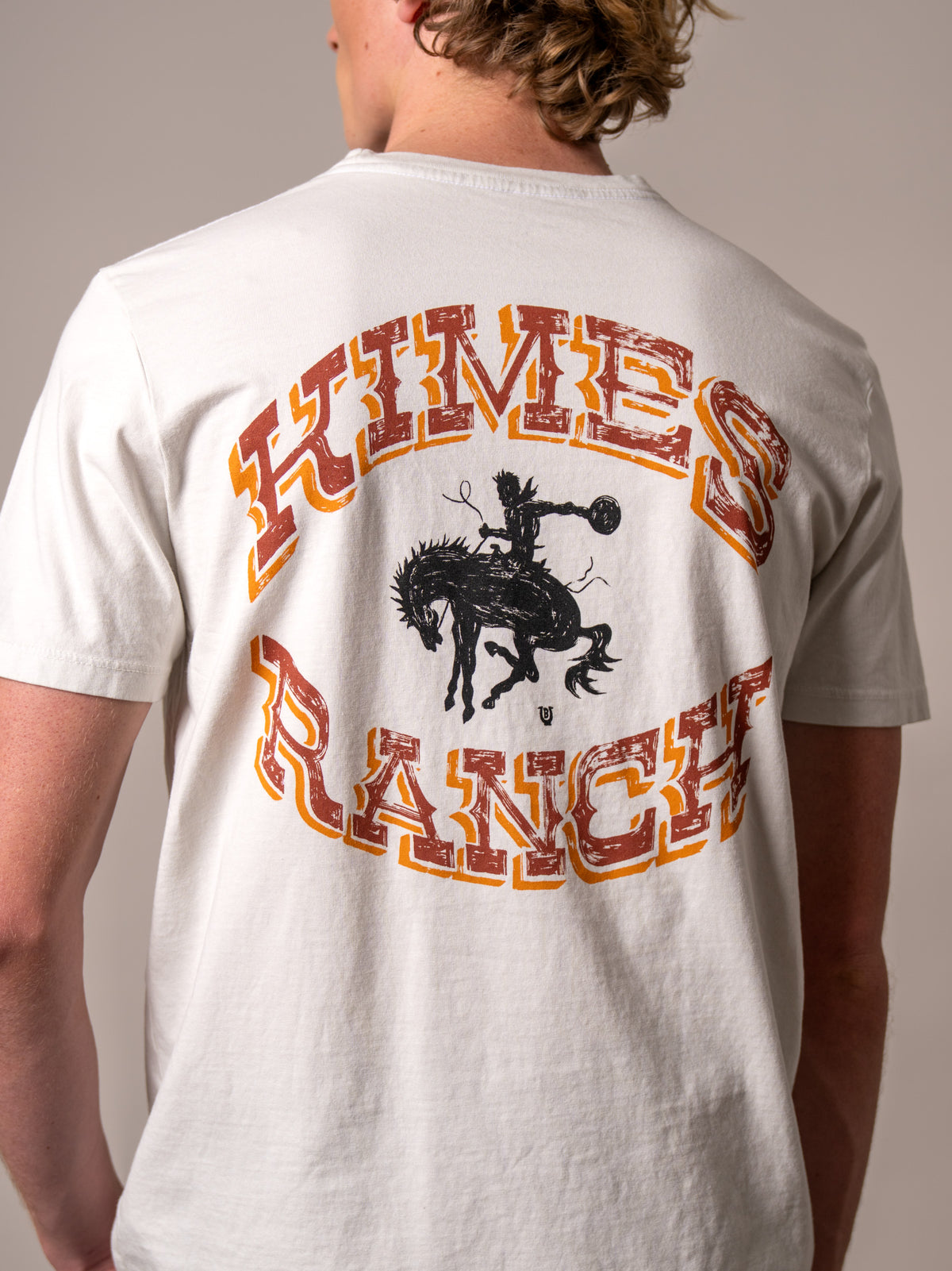 Kimes Ranch Lucky B Bucking, back view, shirt back with Natural colour and Kimes Ranch logo