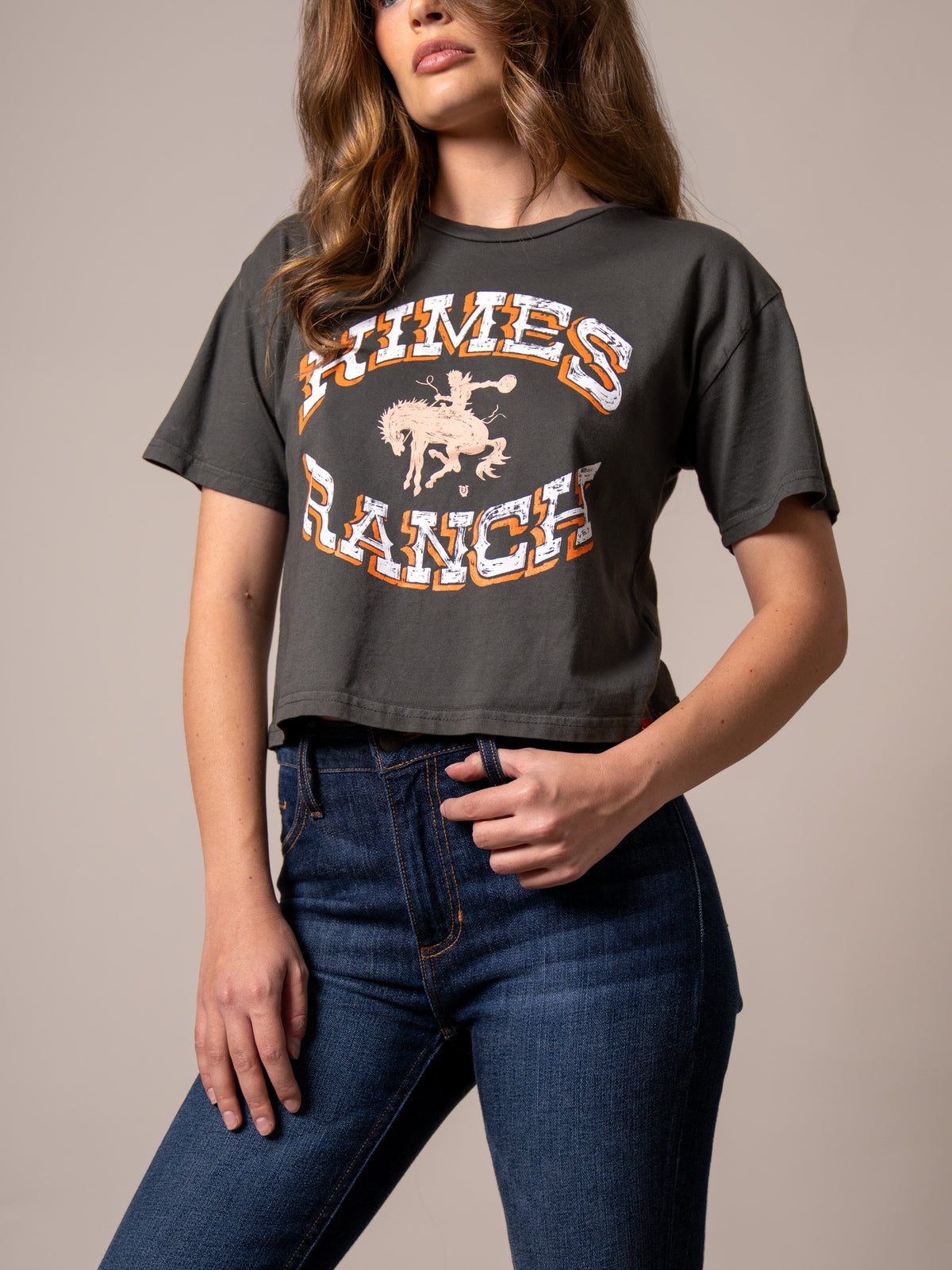 Kimes Ranch Lucky B Bucking shirt in Pepper with a vintage graphic of a cowboy riding a bucking horse