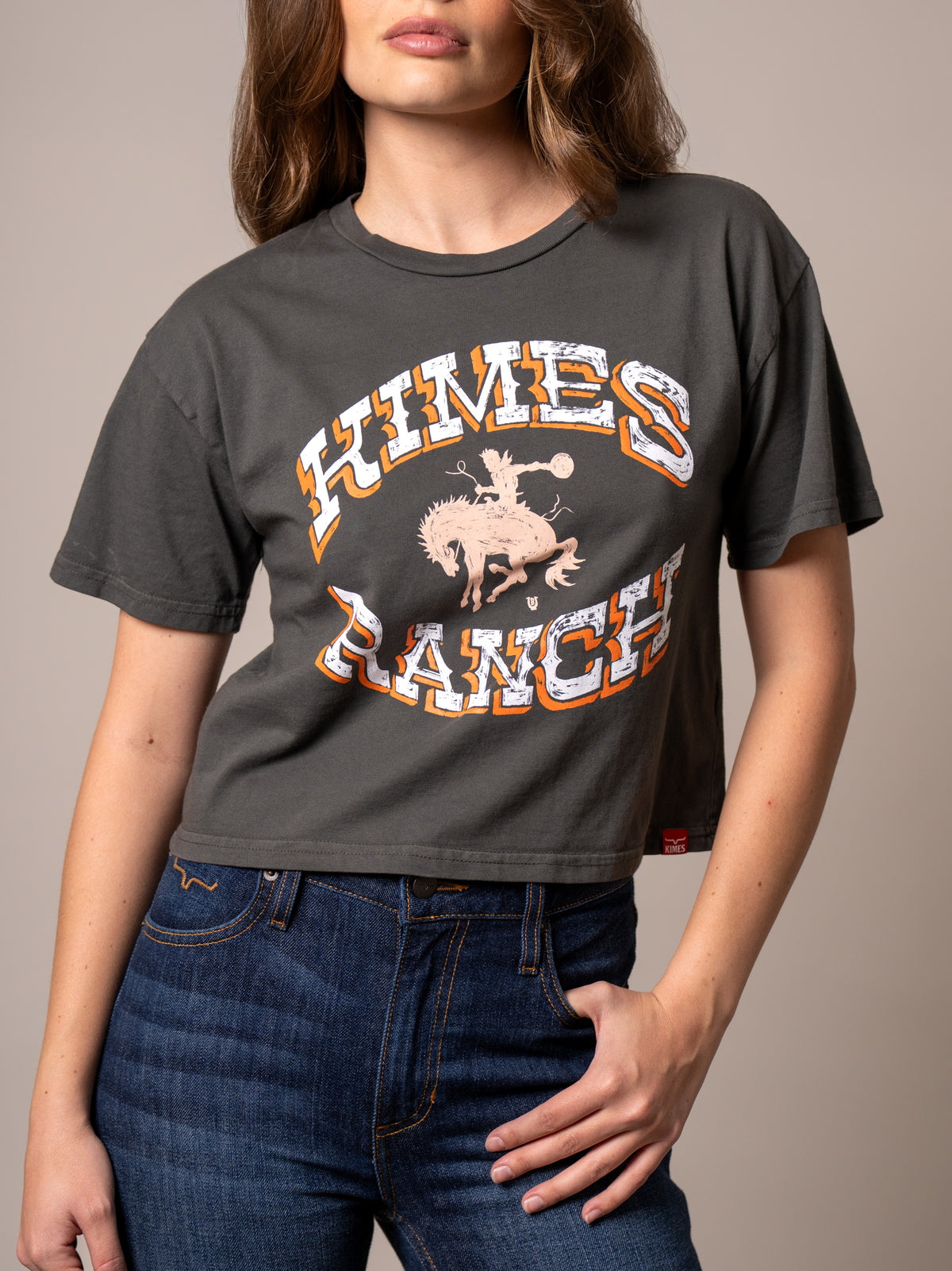 Kimes Ranch Lucky B Bucking shirt in Pepper with a graphic of a cowboy riding a bucking horse and the words Kimes Ranch