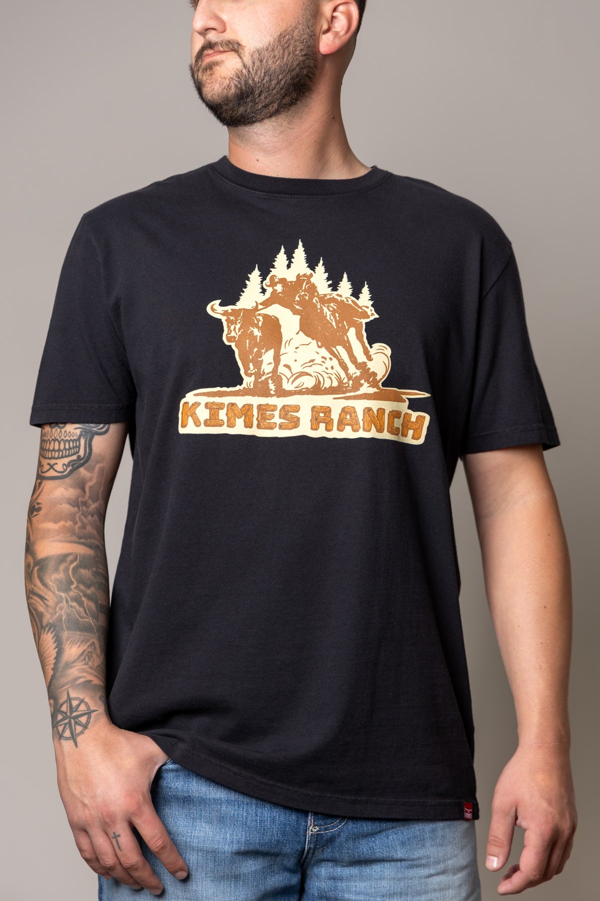 Kimes Ranch Lucky B Bull Dogger shirt in Black with a graphic of a cowboy riding a bull with KIMES RANCH text