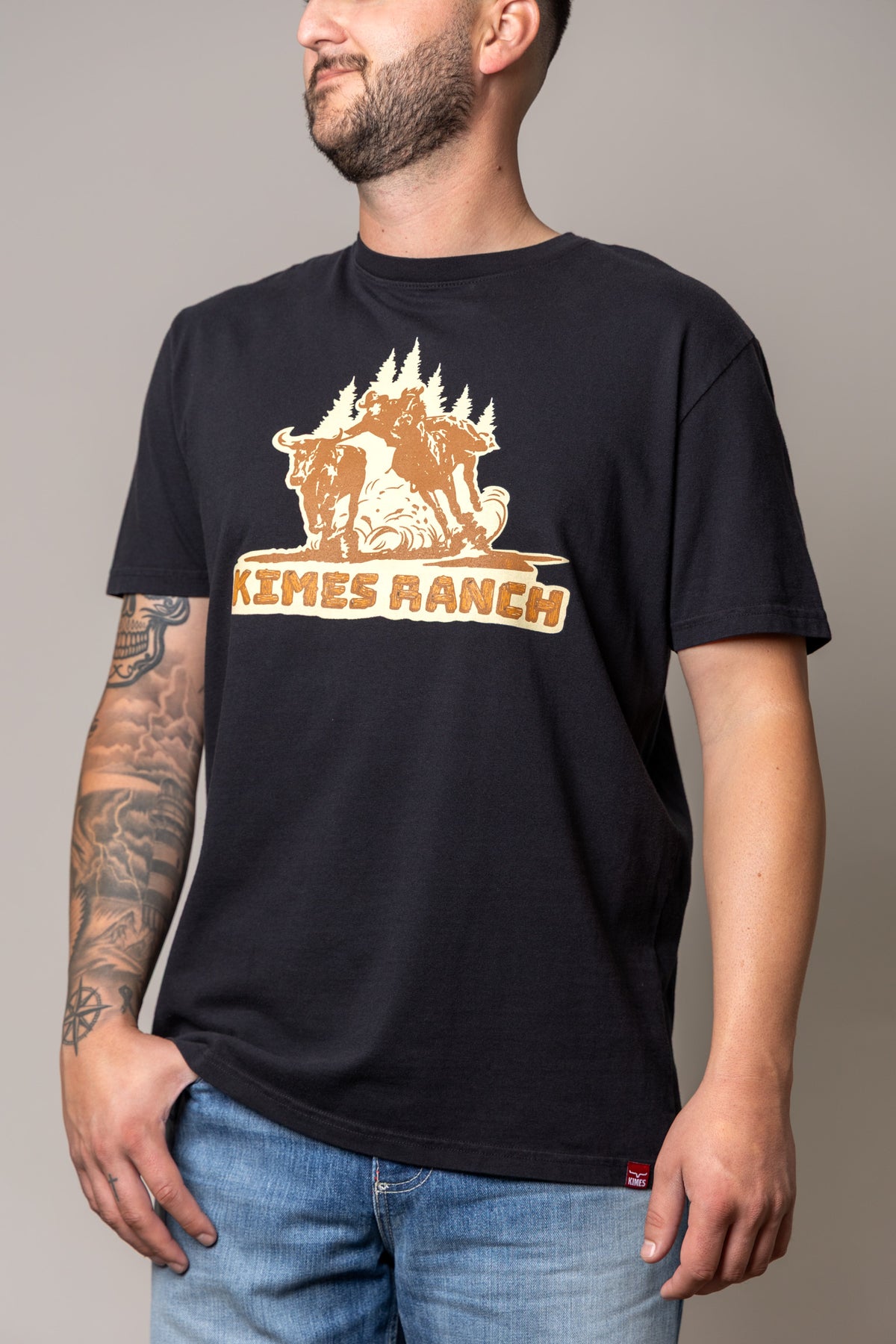 Kimes Ranch Lucky B Bull Dogger shirt in Black with a graphic of a cowboy on a bucking bull with the Kimes Ranch logo