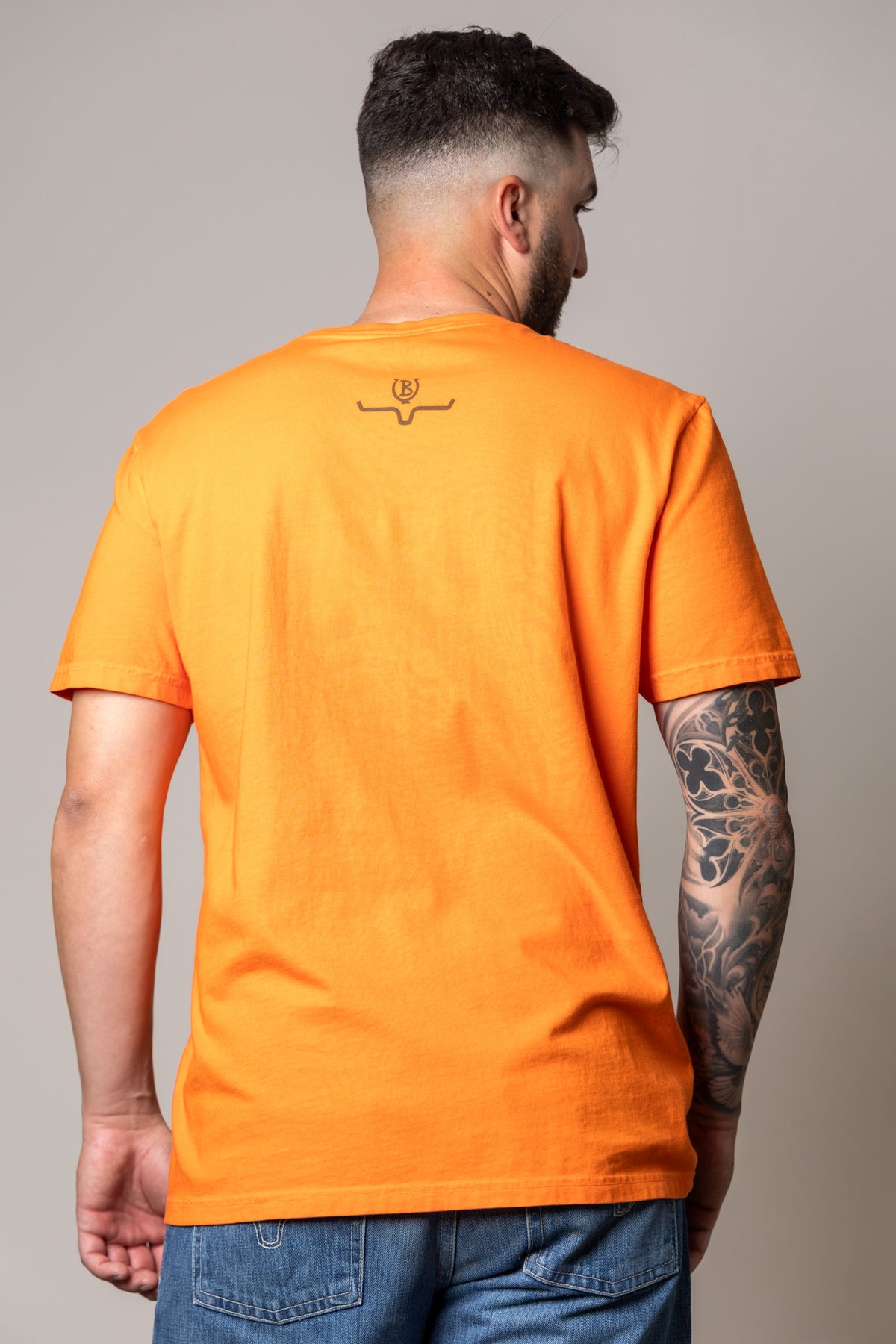 Kimes Ranch Lucky B Bull Dogger shirt in Vintage Orange, back view, with a small logo at the back yoke