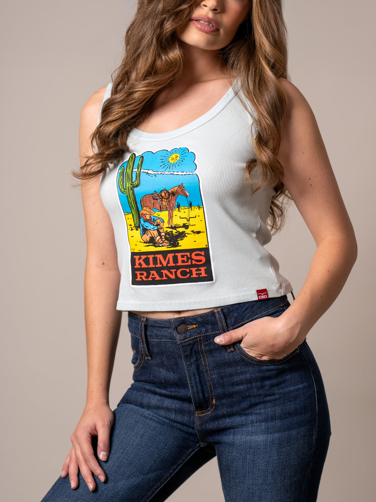 Kimes Ranch Lucky B Dusty Path Ice Blue ribbed tank top with a vintage western graphic and Kimes Ranch logo