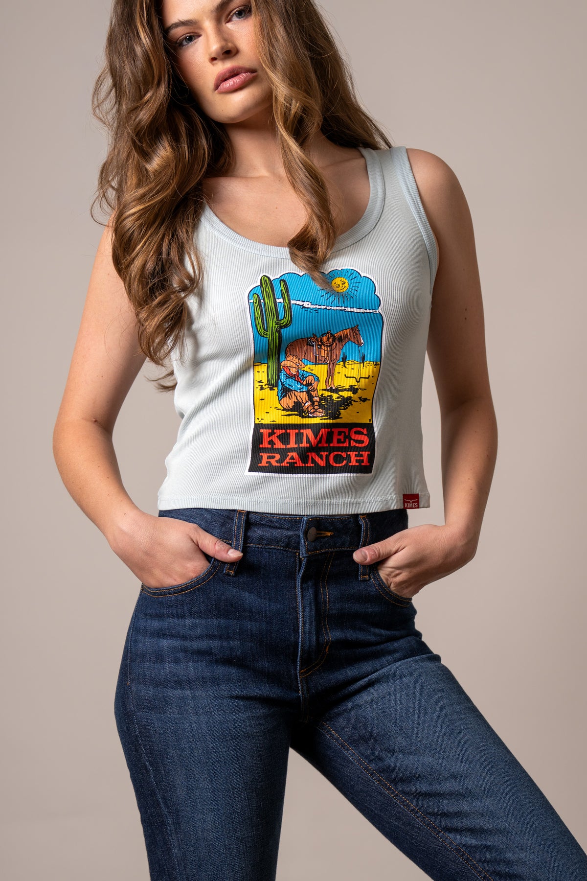 Kimes Ranch Lucky B Dusty Path Ice Blue ribbed tank top with a desert scene graphic and Kimes Ranch logo