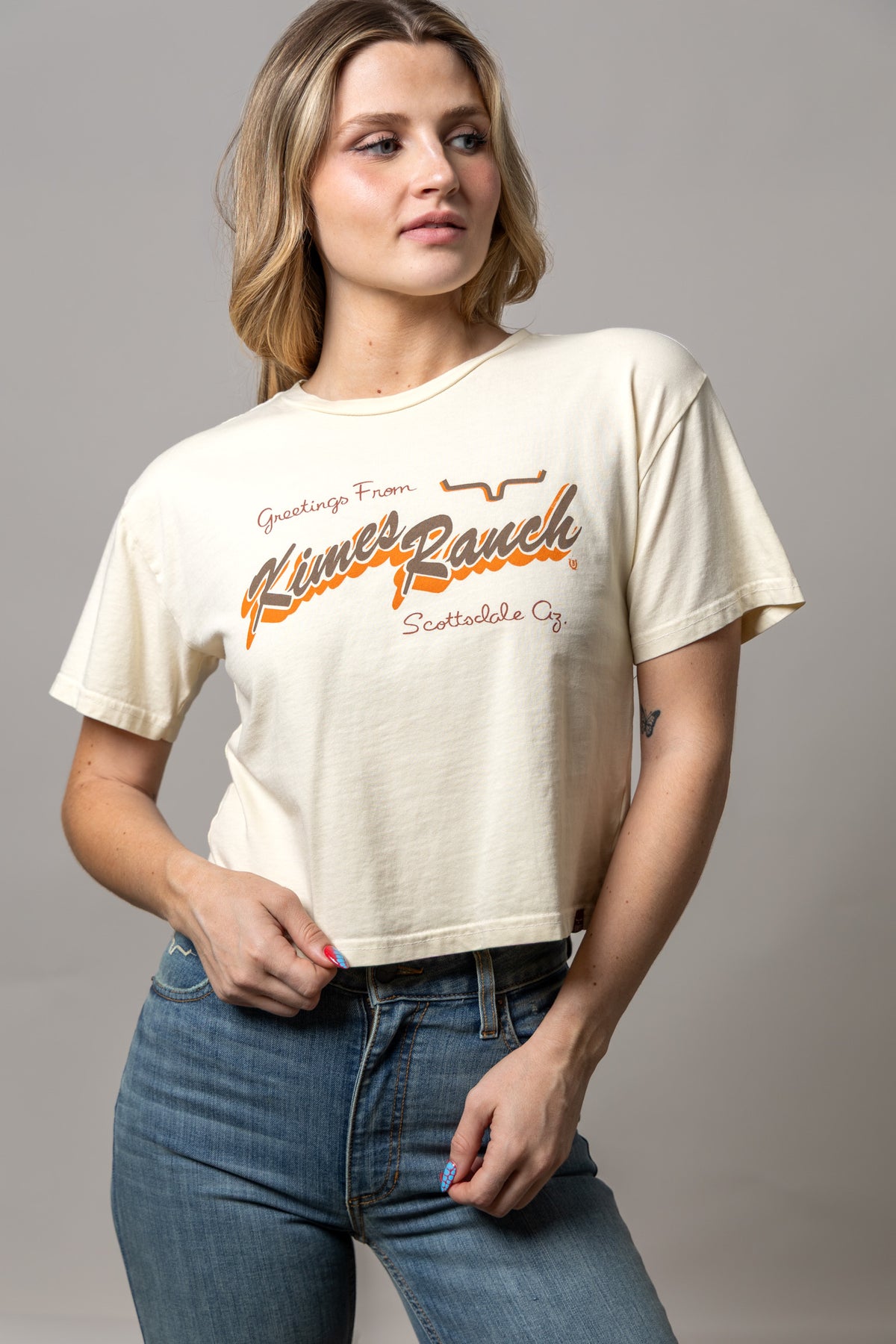Kimes Ranch Lucky B Greetings Ivory shirt with a vintage graphic print featuring the brand name and Scottsdale Az