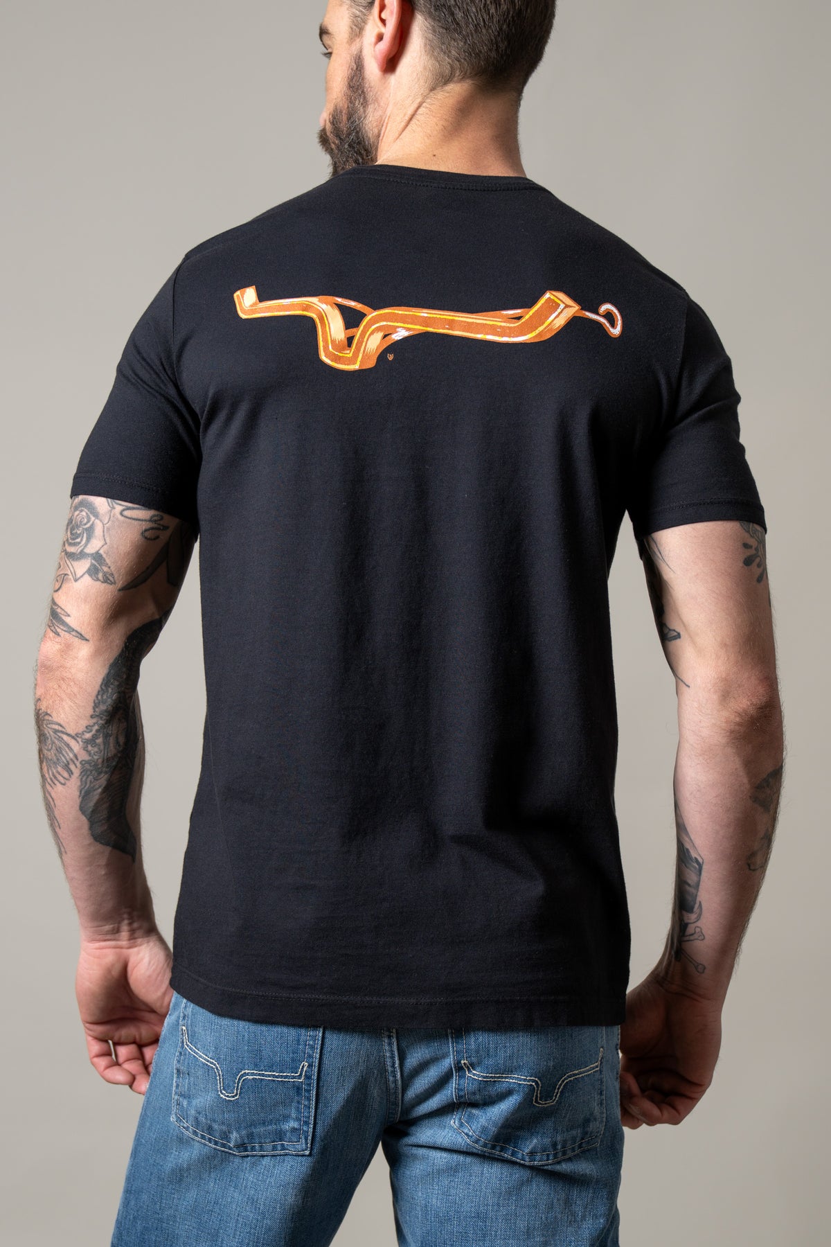 Kimes Ranch Lucky B Iron shirt in Black, back view, with a large orange horseshoe graphic on the back