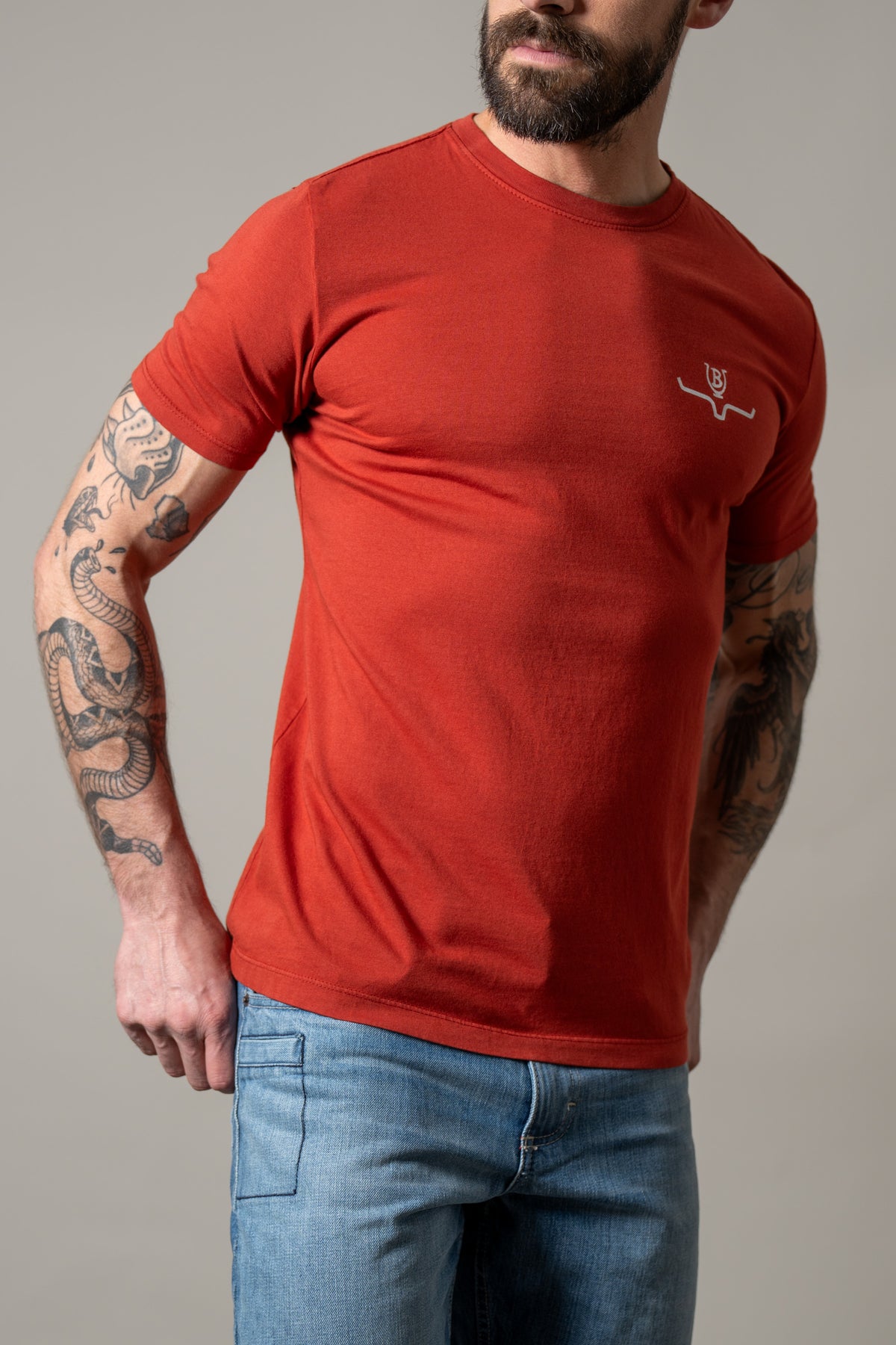 Kimes Ranch Lucky B Iron shirt in Brick Red with a crew neck and the Kimes Ranch logo on the chest
