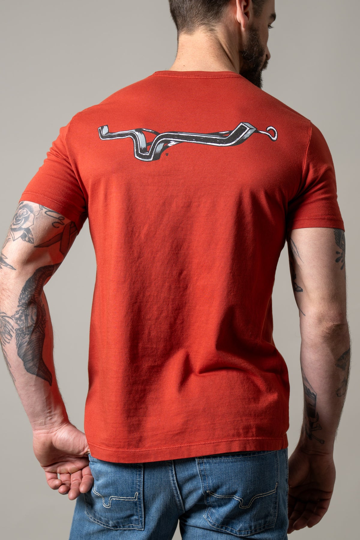 Kimes Ranch Lucky B Iron shirt in Brick Red, back view, with a back graphic of a horseshoe