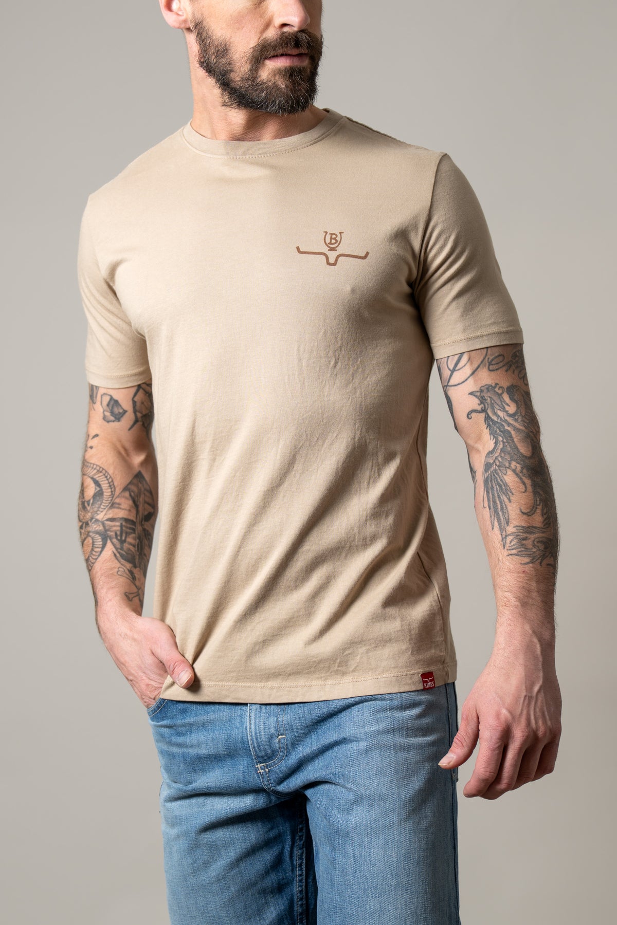 Kimes Ranch Lucky B Iron shirt in Sand with a small embroidered logo on the chest