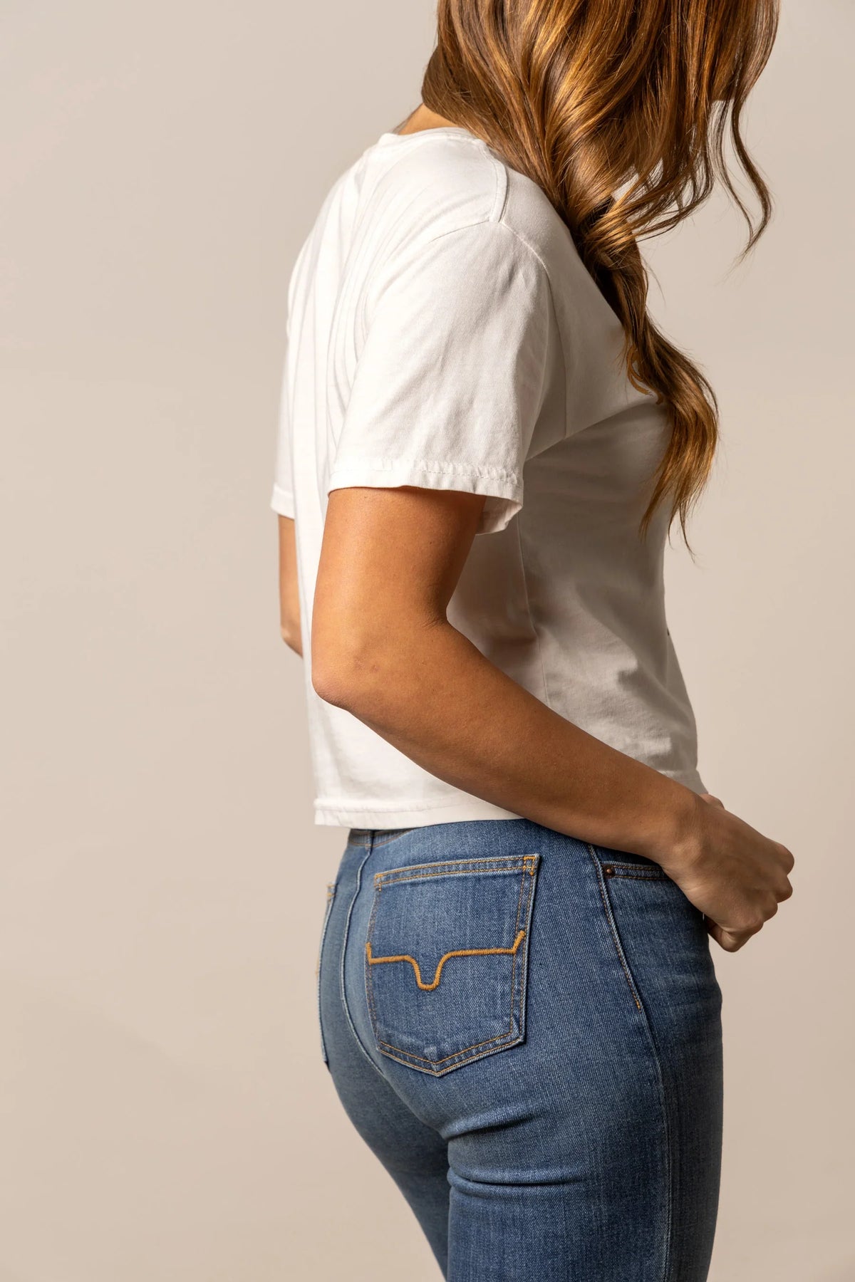 Kimes Ranch Lucky B Rodee-oh! shirt in Bone, side view, with the short sleeves and curved hem