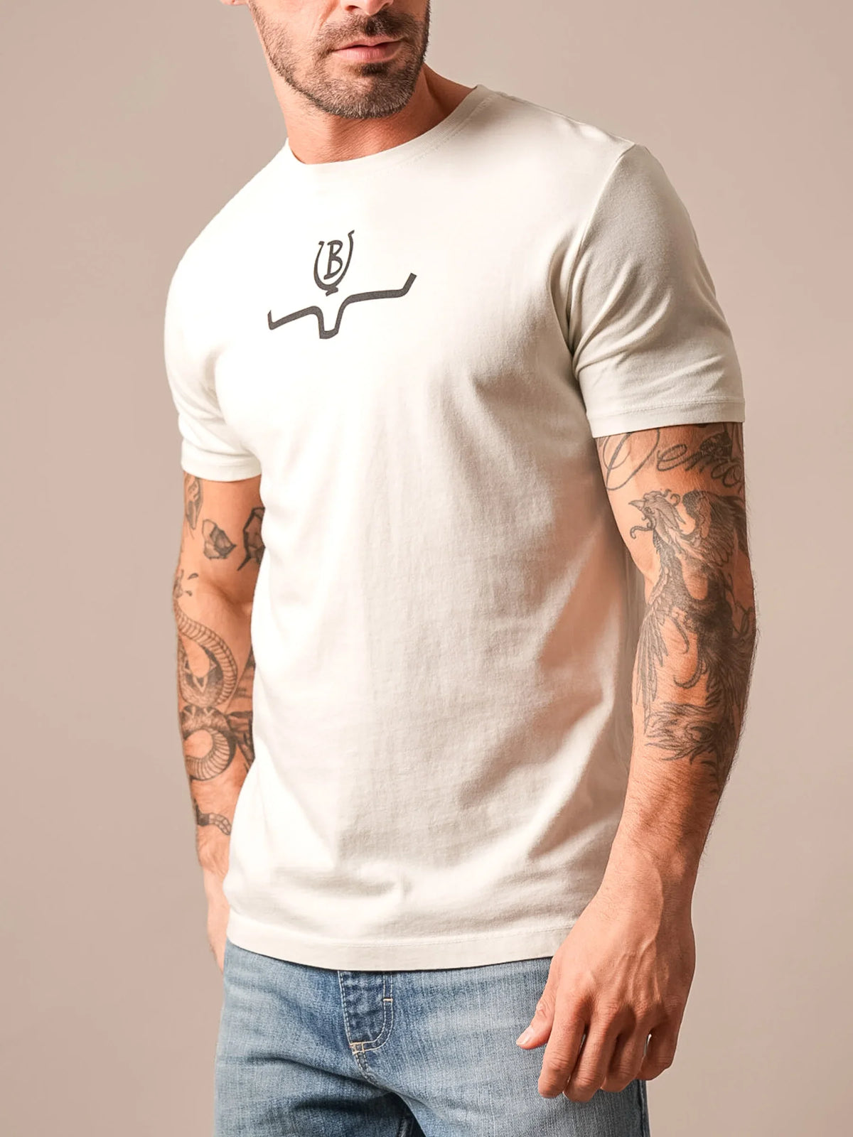 Kimes Ranch Lucky B Saddle short sleeve shirt in Natural with a stylized steer logo on the chest