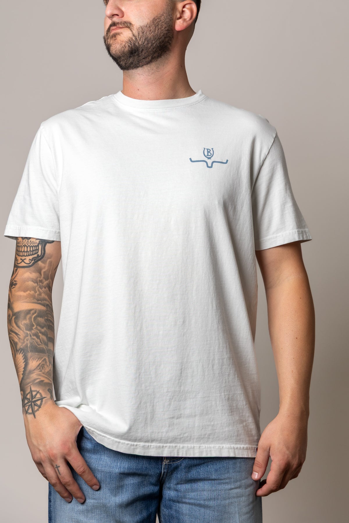 Kimes Ranch Lucky B Statewide shirt in Muted White with a small blue logo on the chest
