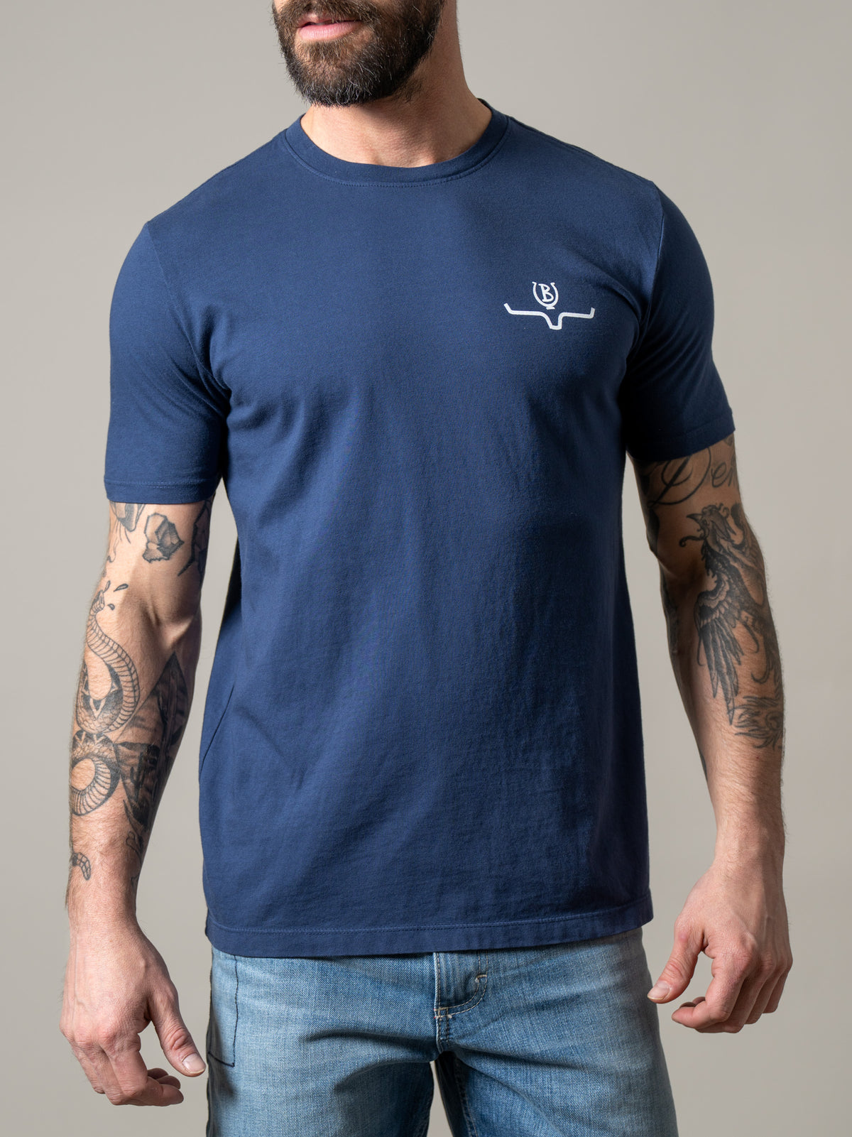 Kimes Ranch Lucky B Sun Had Just Risen shirt in Indigo with a crew neck and short sleeves and a white logo on the chest