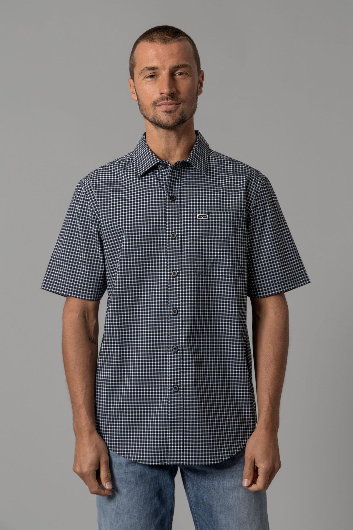 Kimes Ranch MC Cooper short sleeve dress shirt in Black with a white check pattern and a chest pocket