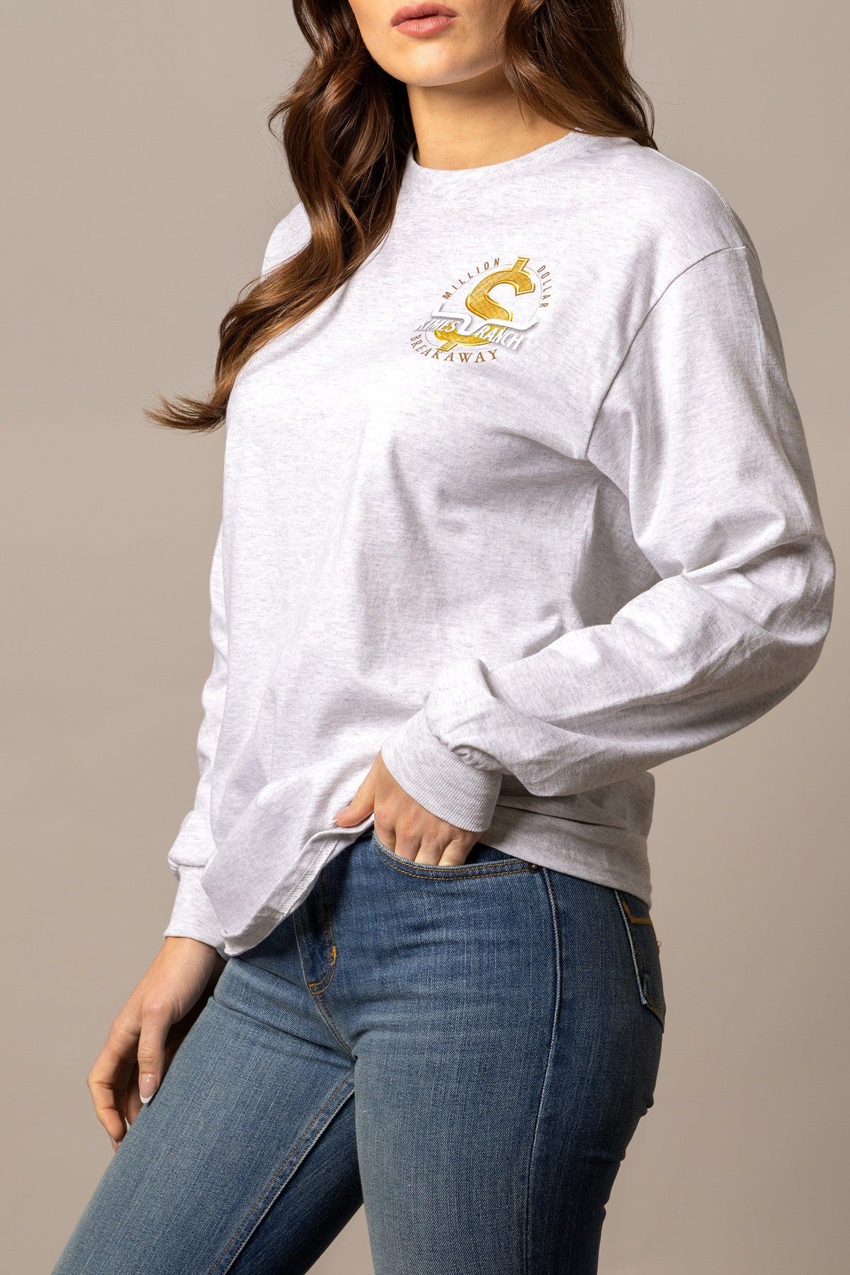 Kimes Ranch MDB Long Sleeve shirt in Ash Heather, side view, with gold dollar sign graphic and Million Dollar Breakaway text