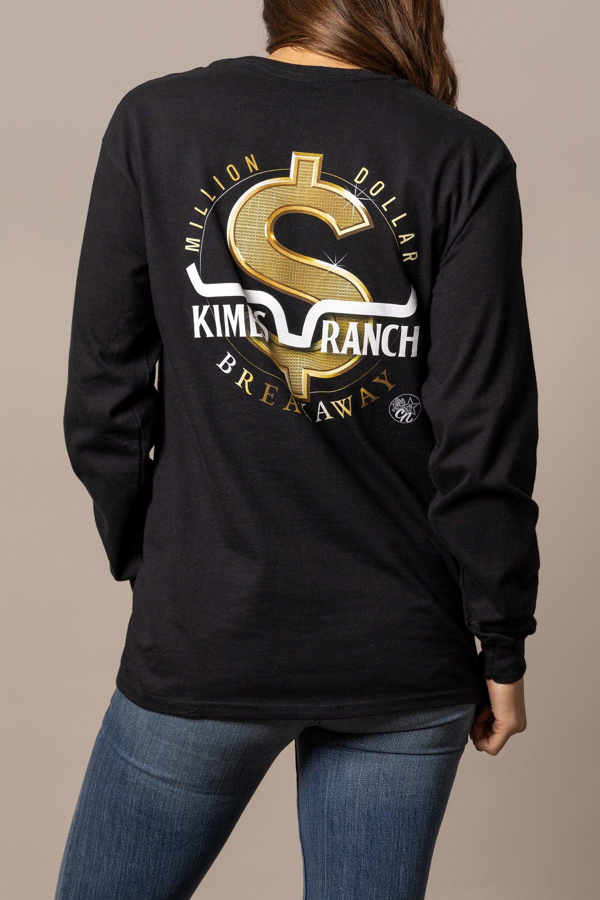 Kimes Ranch MDB Long Sleeve shirt in Black, back view, with a gold dollar sign graphic and white Kimes Ranch logo on the back