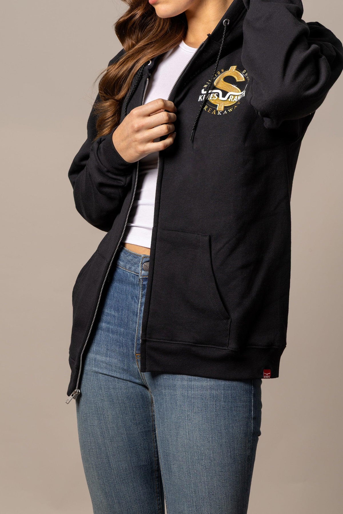 Kimes Ranch MDB Zip Up hoodie in black with a gold dollar sign graphic and kangaroo pocket