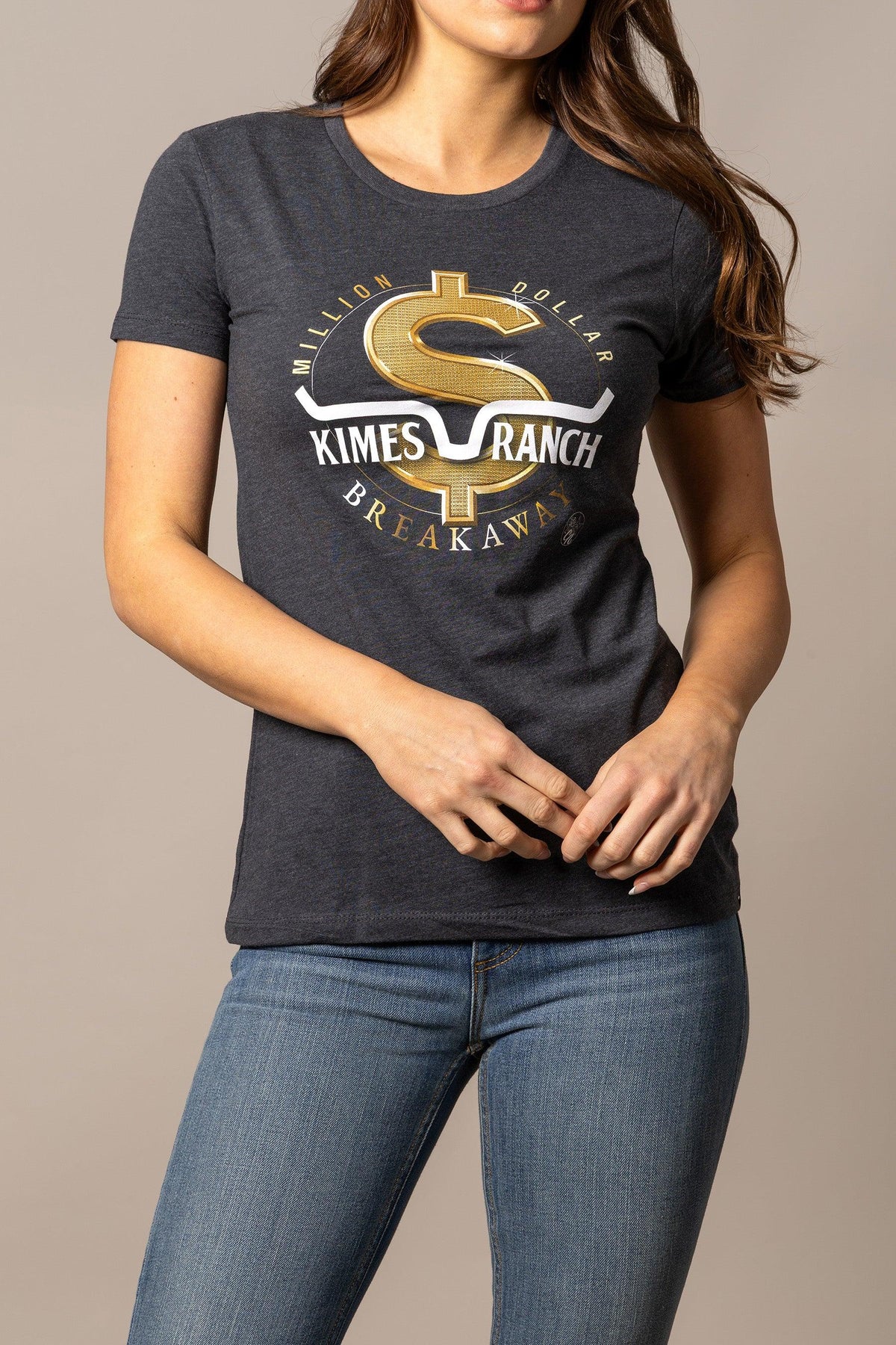 Kimes Ranch Women's MDB Tee in Charcoal with a gold dollar sign graphic and Million Dollar Breakaway text