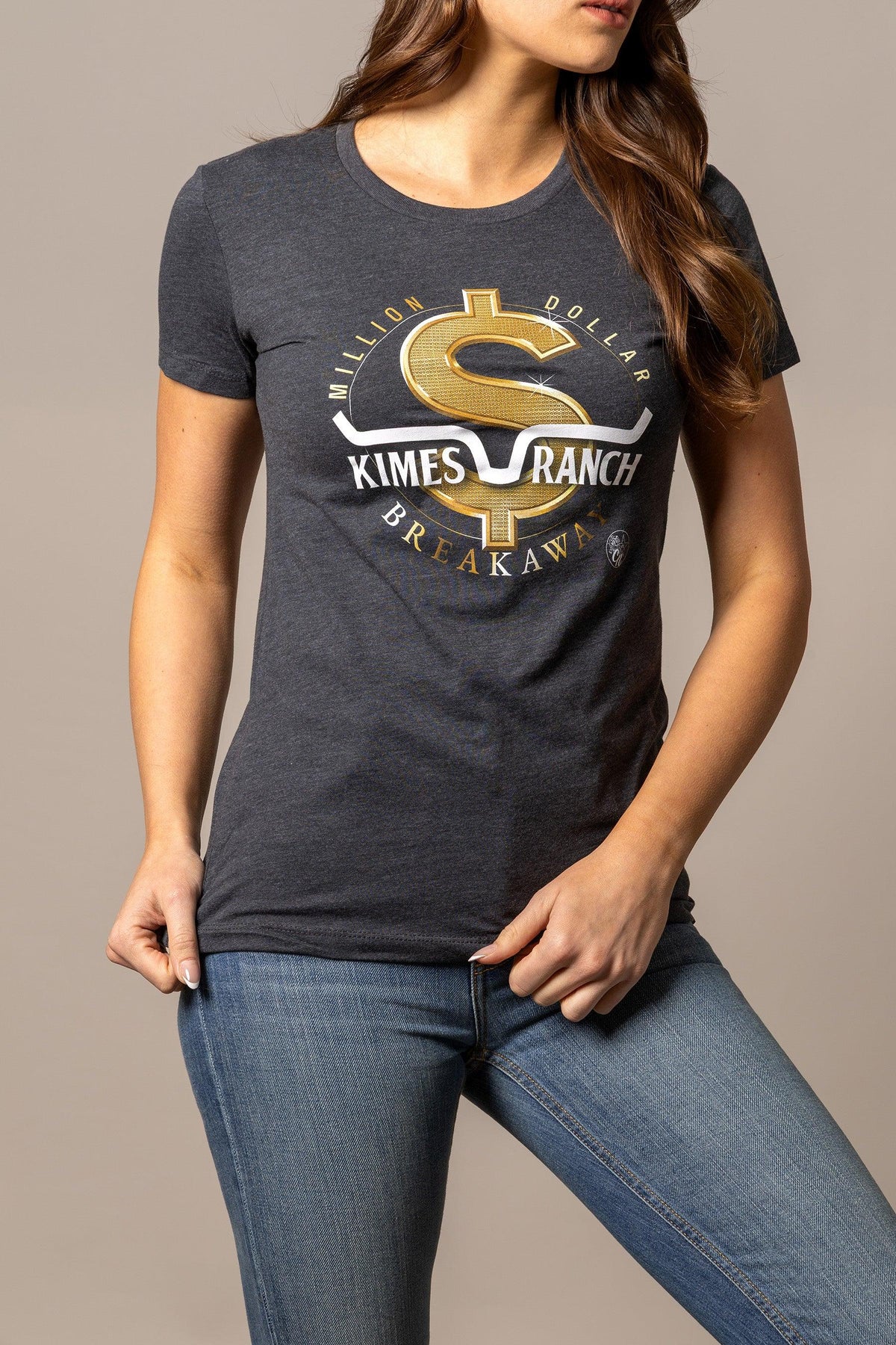 Kimes Ranch Women's MDB Tee in charcoal with a gold dollar sign graphic and Million Dollar Breakaway text