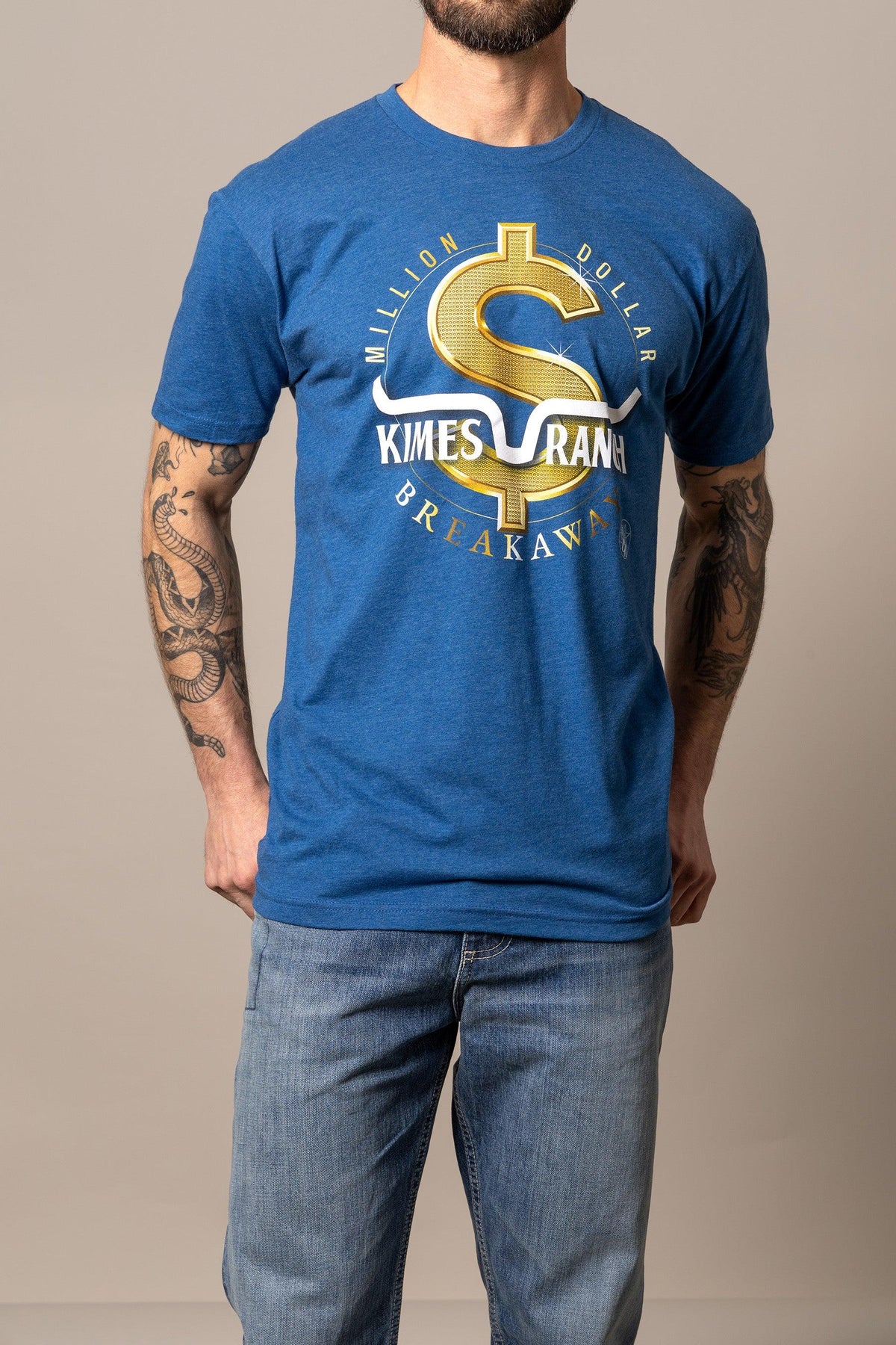 Kimes Ranch Men's MDB Tee in blue with a gold dollar sign graphic and 'Million Dollar Breakaway' text