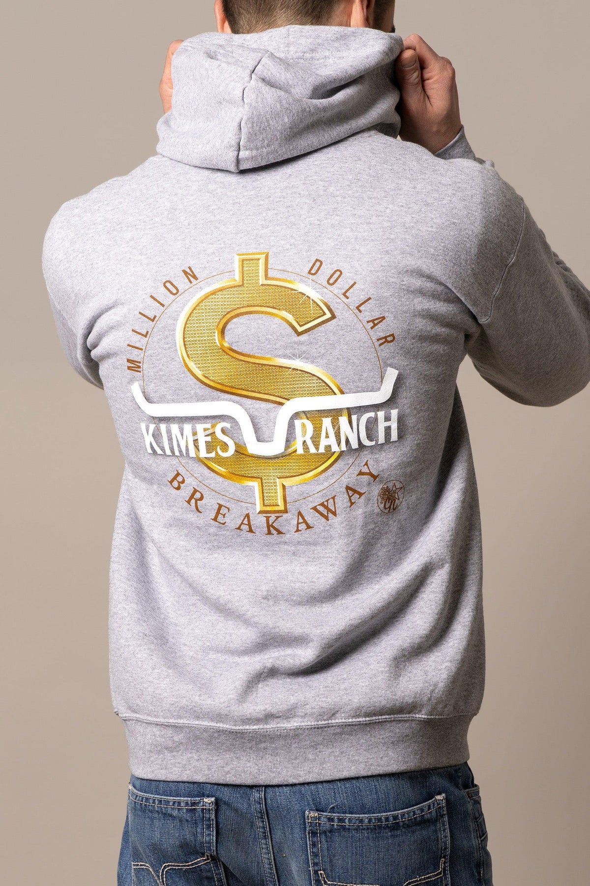 Kimes Ranch MDB Zip Up hoodie back with a gold dollar sign graphic with Million Dollar Breakaway text