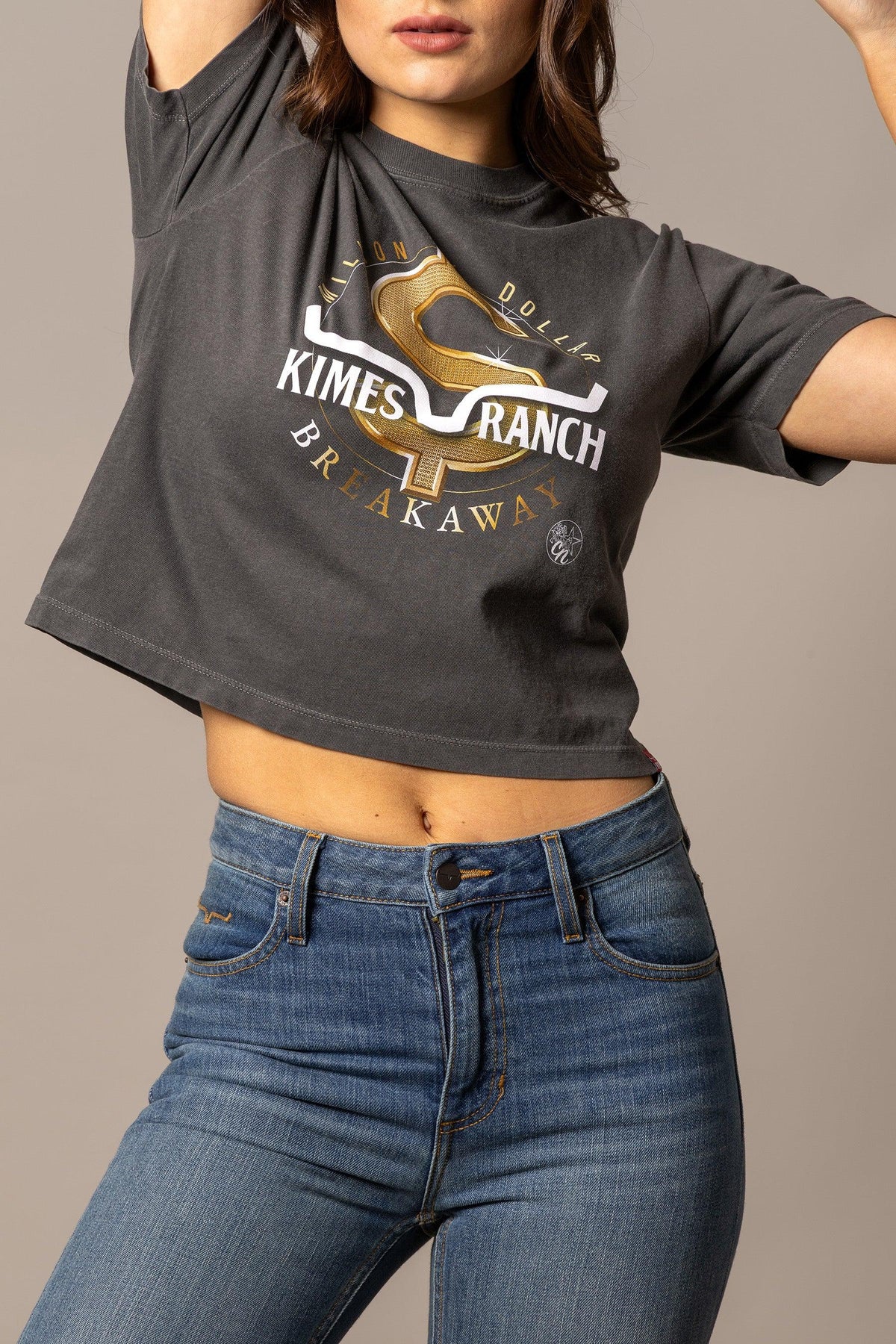 Kimes Ranch MDB Women's Crop Tee in black with a gold dollar sign graphic and 'Breakaway' text