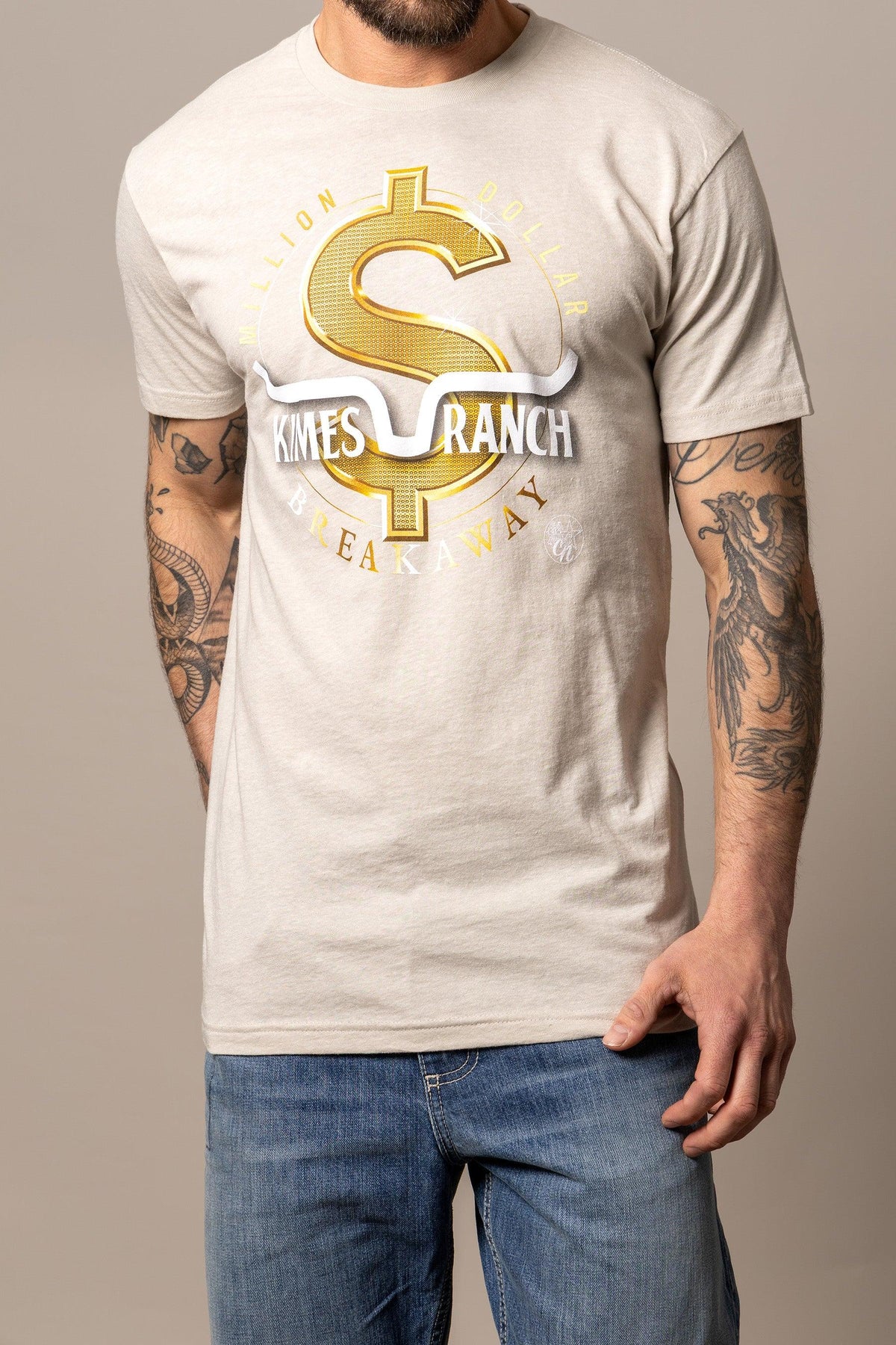 Kimes Ranch Men's MDB Tee in Sand with a gold dollar sign graphic and Kimes Ranch logo
