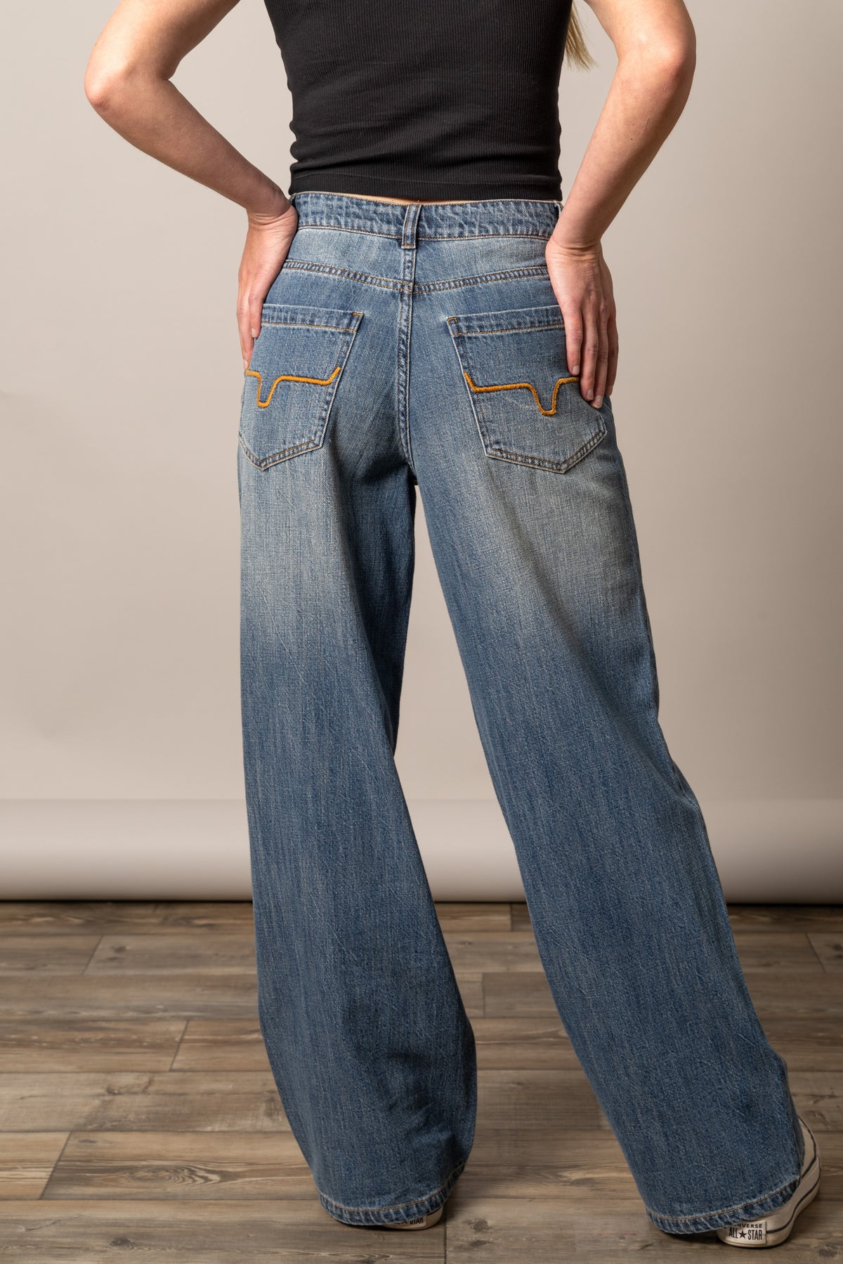 Kimes Ranch Maggie jeans in Antique Wash, back view, with wide leg silhouette and signature orange back pocket stitching