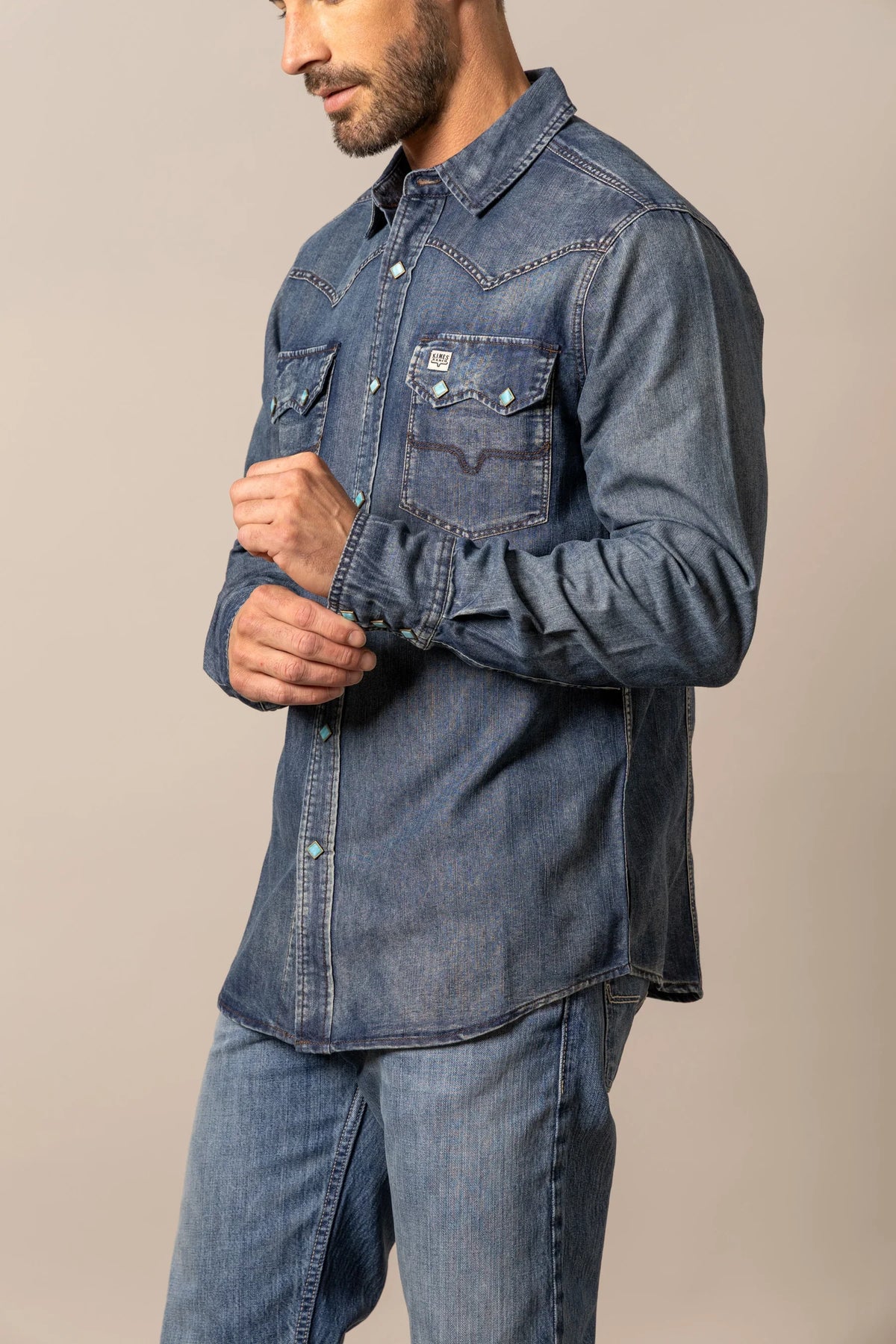 Kimes Ranch Memphis, side view, Indigo long sleeve shirt with turquoise snap buttons and chest pockets