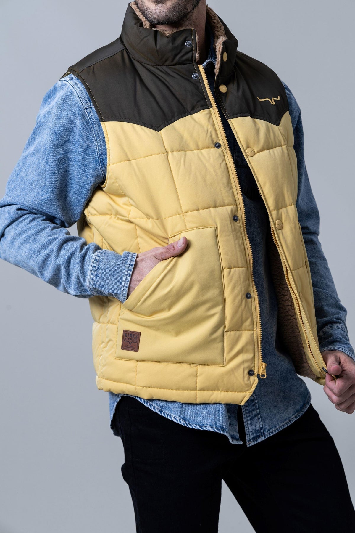 Kimes Ranch Muir Trail Vest in Dark Brown with quilted yellow body and front pockets