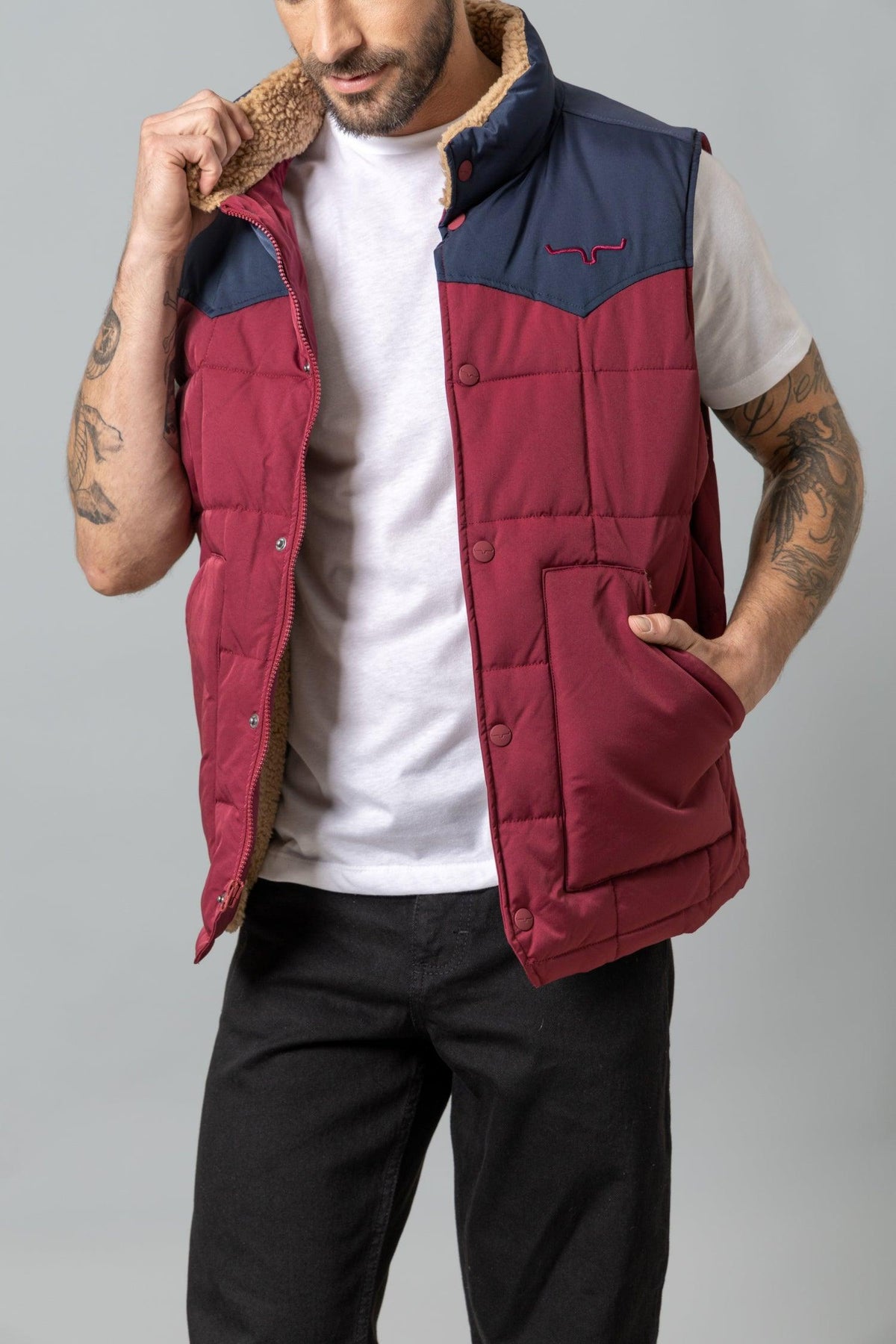 Kimes Ranch Muir Trail Vest in Burgundy with navy yoke and sherpa collar, featuring front pockets and logo