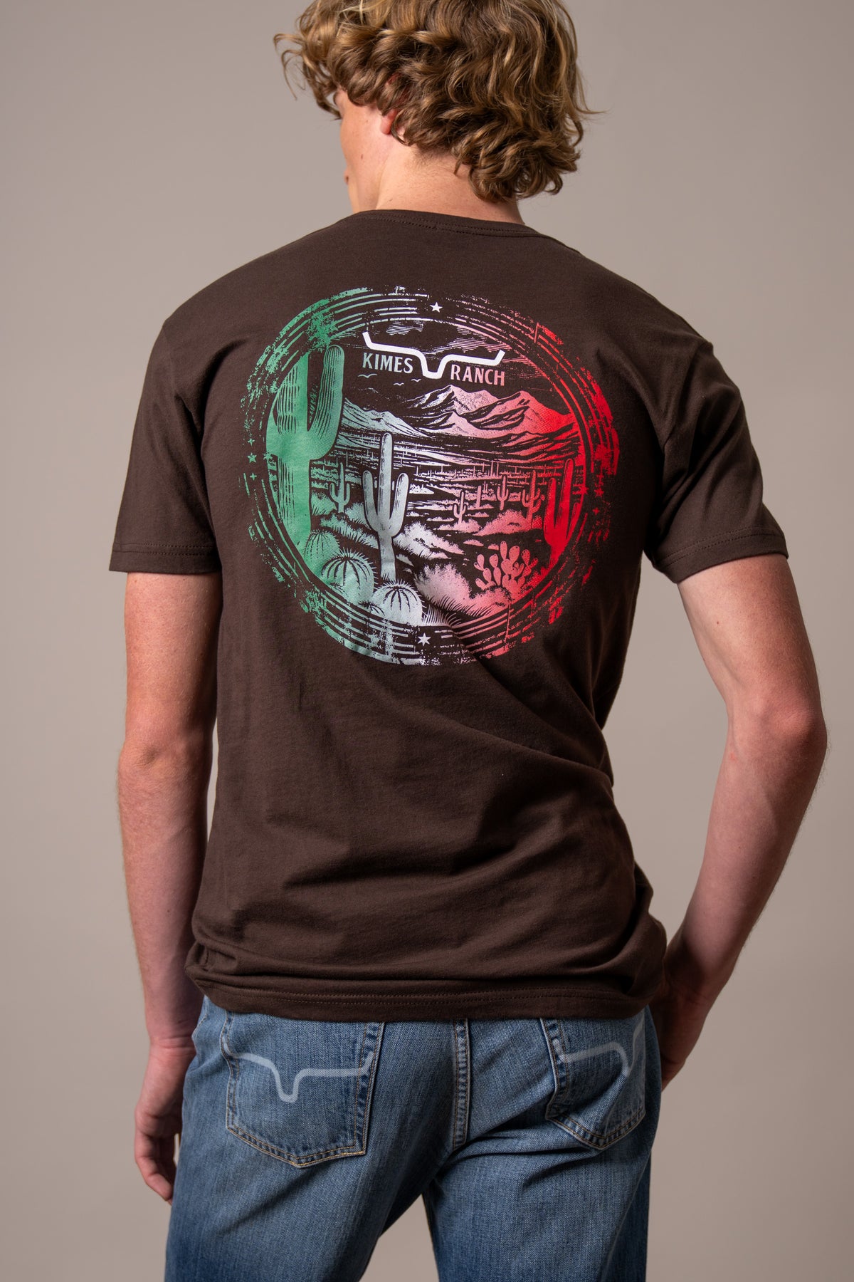 Kimes Ranch Mexico Prairie shirt in Dark Chocolate, back view, with a circular desert landscape graphic
