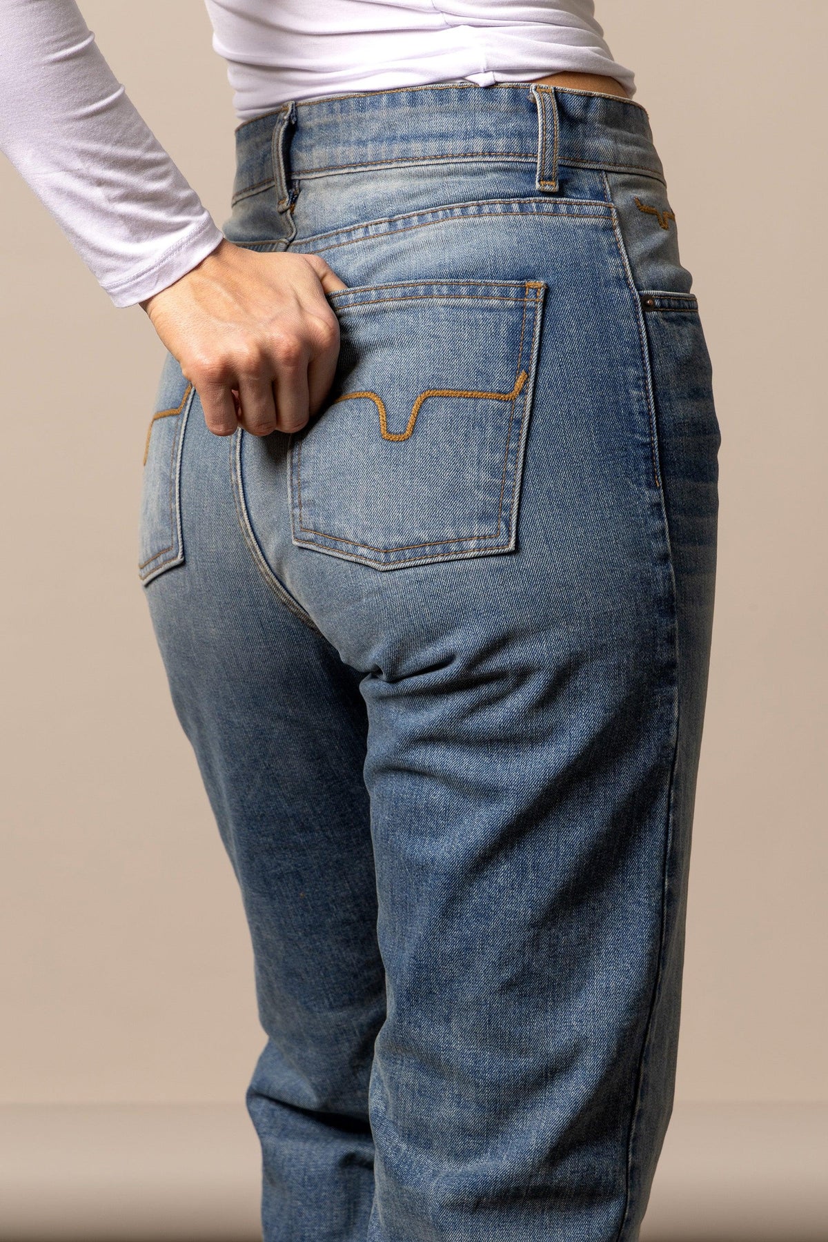 Kimes Ranch Mia, back view, jeans in blue with back pockets and signature stitching