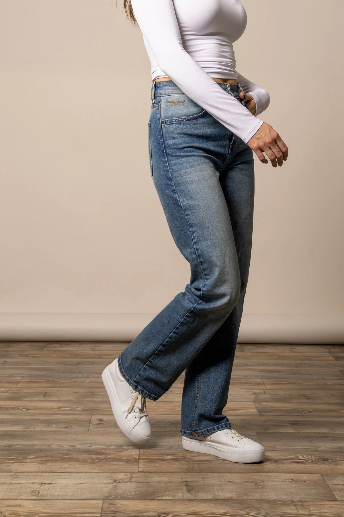 Kimes Ranch Mia, side view, jeans in blue with the straight leg silhouette and back pocket detail