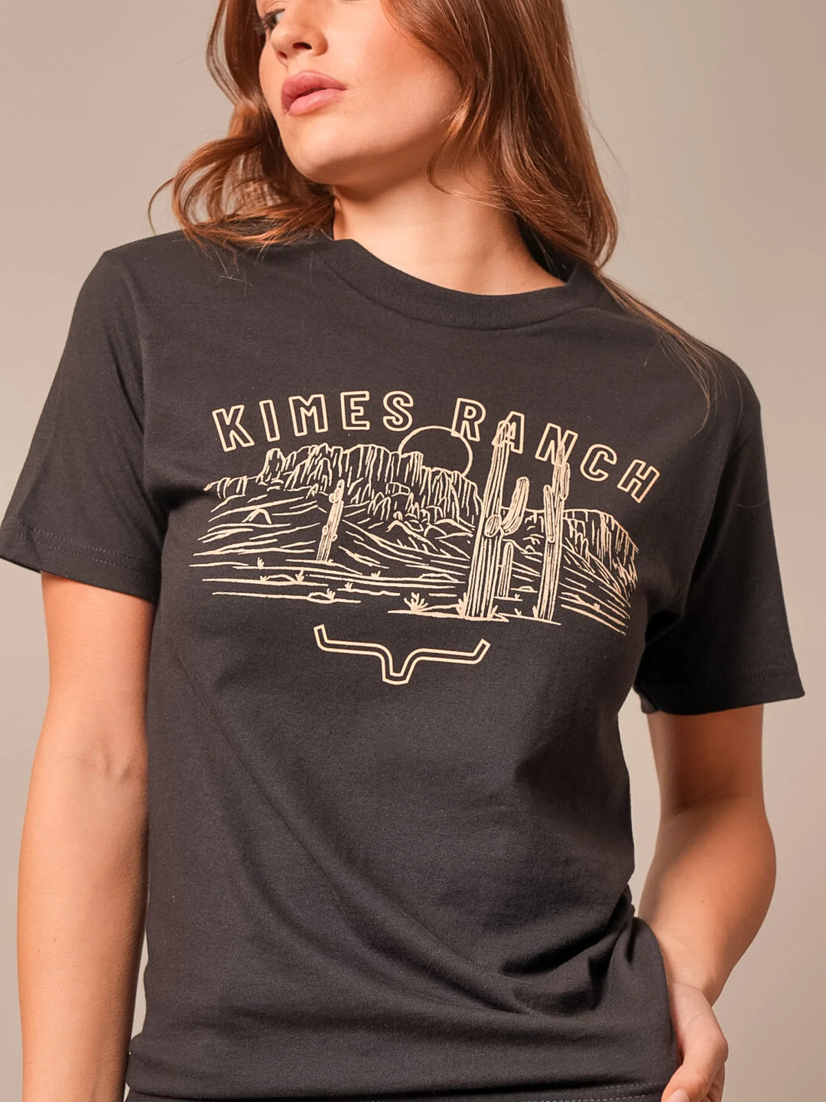 Kimes Ranch Mountain Badge shirt in Black with a desert landscape graphic and the Kimes Ranch logo