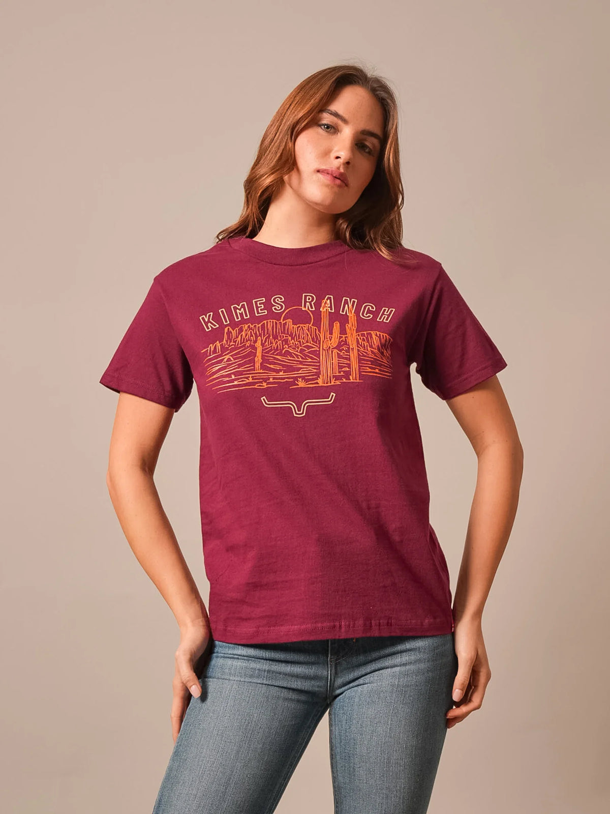 Kimes Ranch Mountain Badge shirt in Burgundy with a desert landscape graphic and Kimes Ranch logo