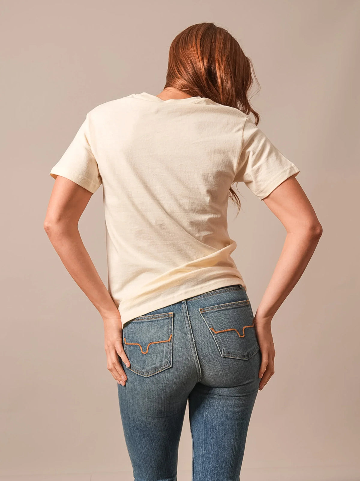 Kimes Ranch Mountain Badge, back view, Cream short sleeve shirt with back yoke and curved hem