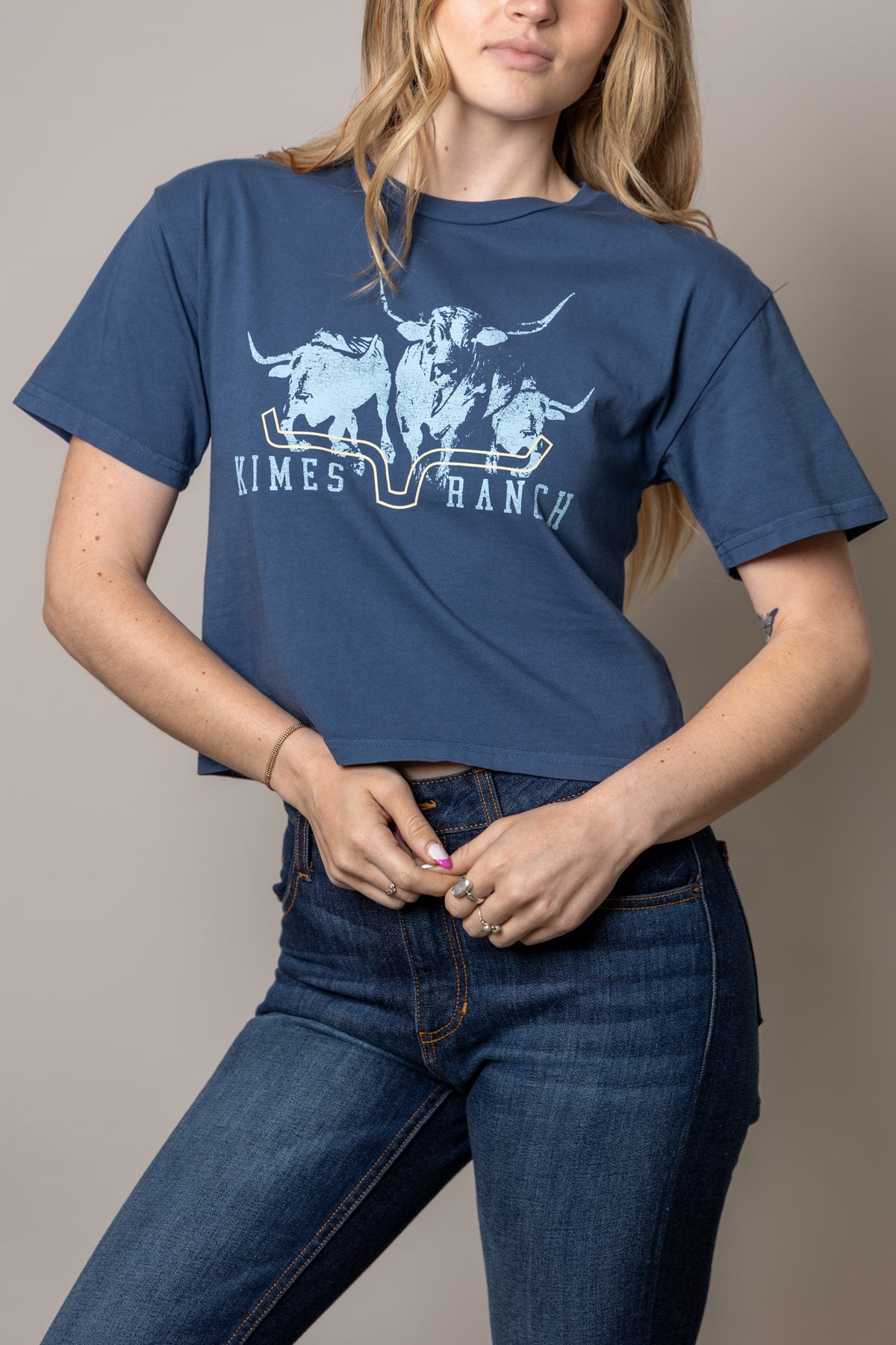 Kimes Ranch Movin' Out shirt in Dark Blue with a graphic of three longhorns and the brand name