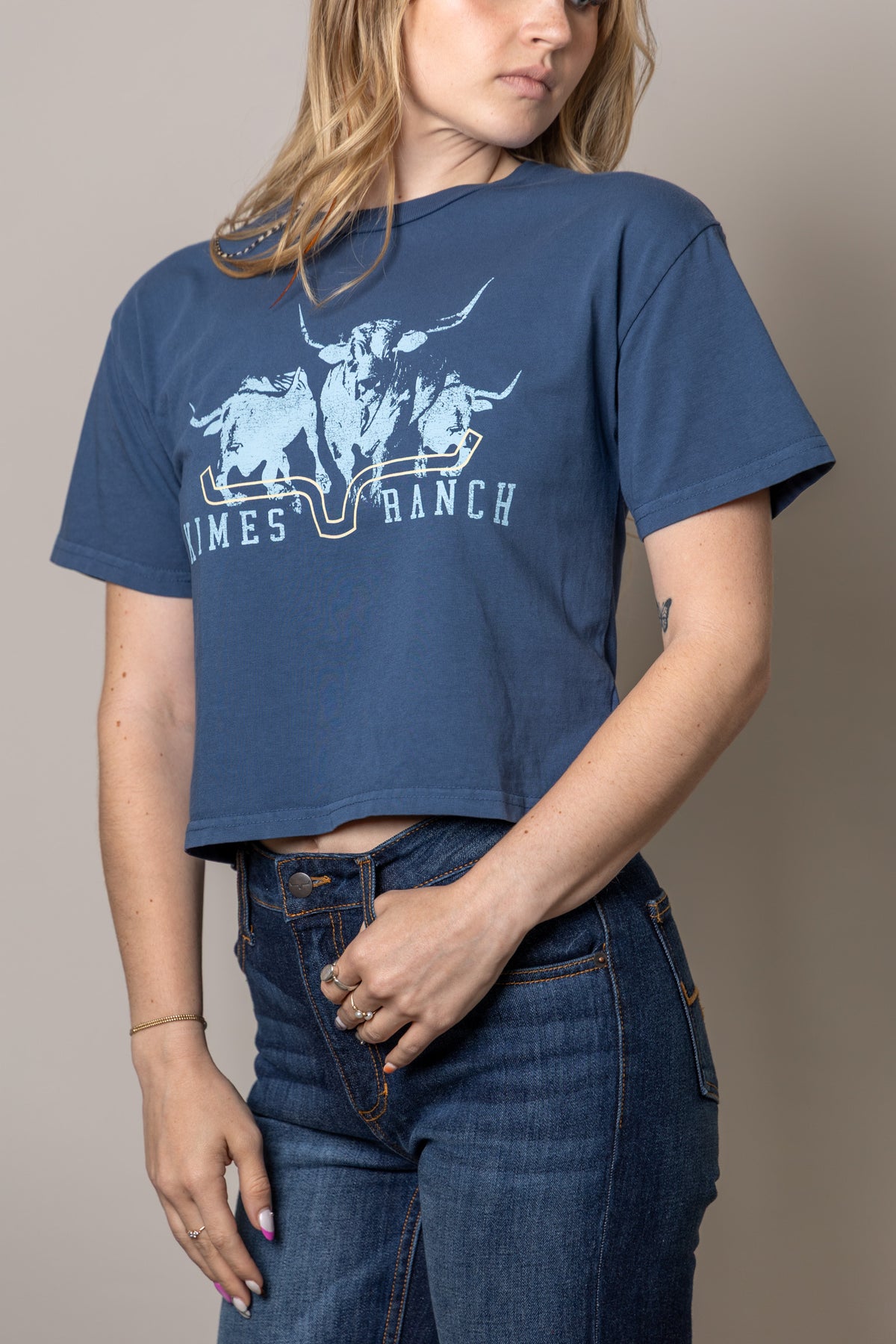 Kimes Ranch Movin' Out shirt in Dark Blue with a graphic of three longhorns and the brand name