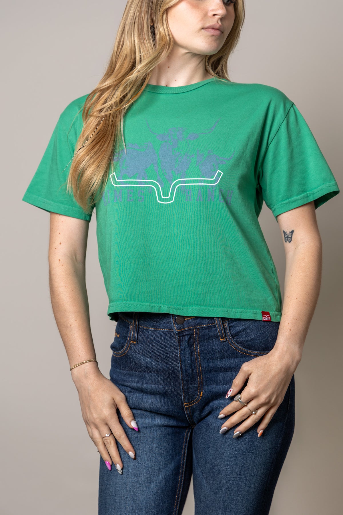 Kimes Ranch Movin' Out shirt in Kelly Green with a graphic print of the Kimes Ranch logo and the Kimes Ranch logo